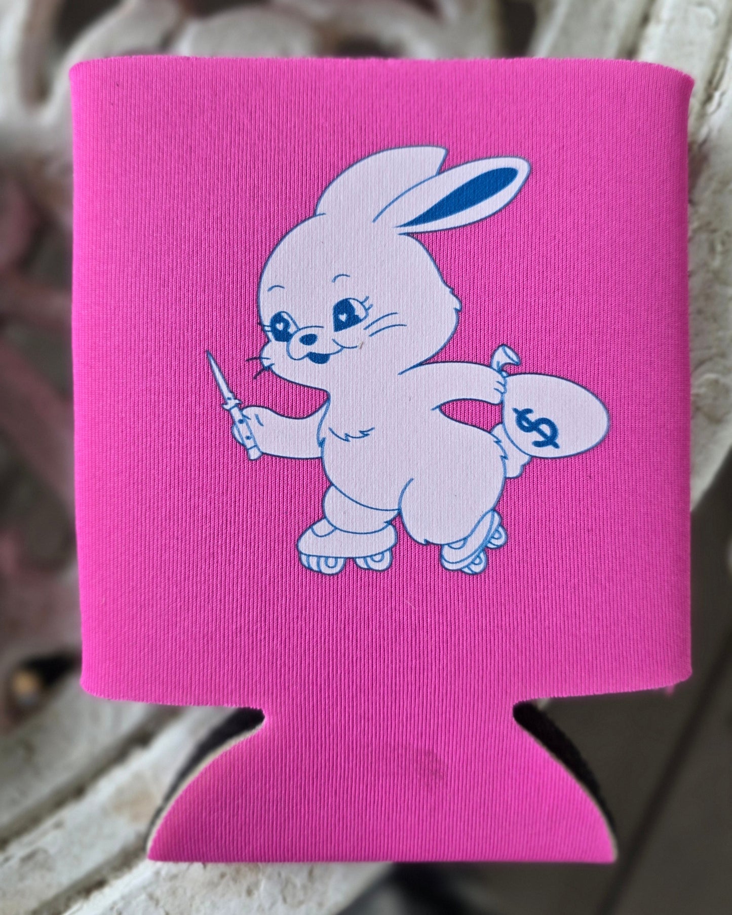 Pink can cooler with cartoon character attached to a car wheel.