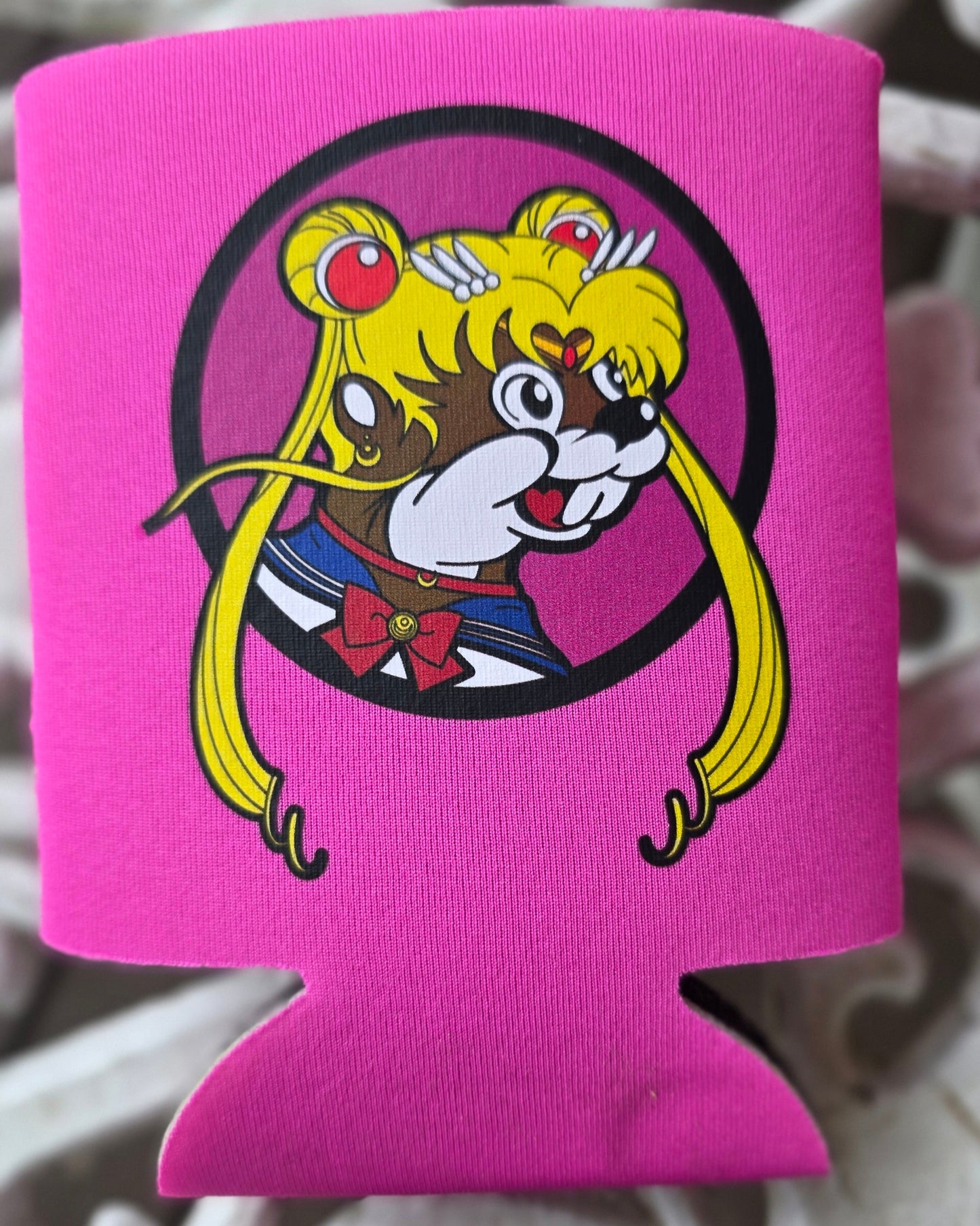 Pink can cooler with cartoon character design on a textured background