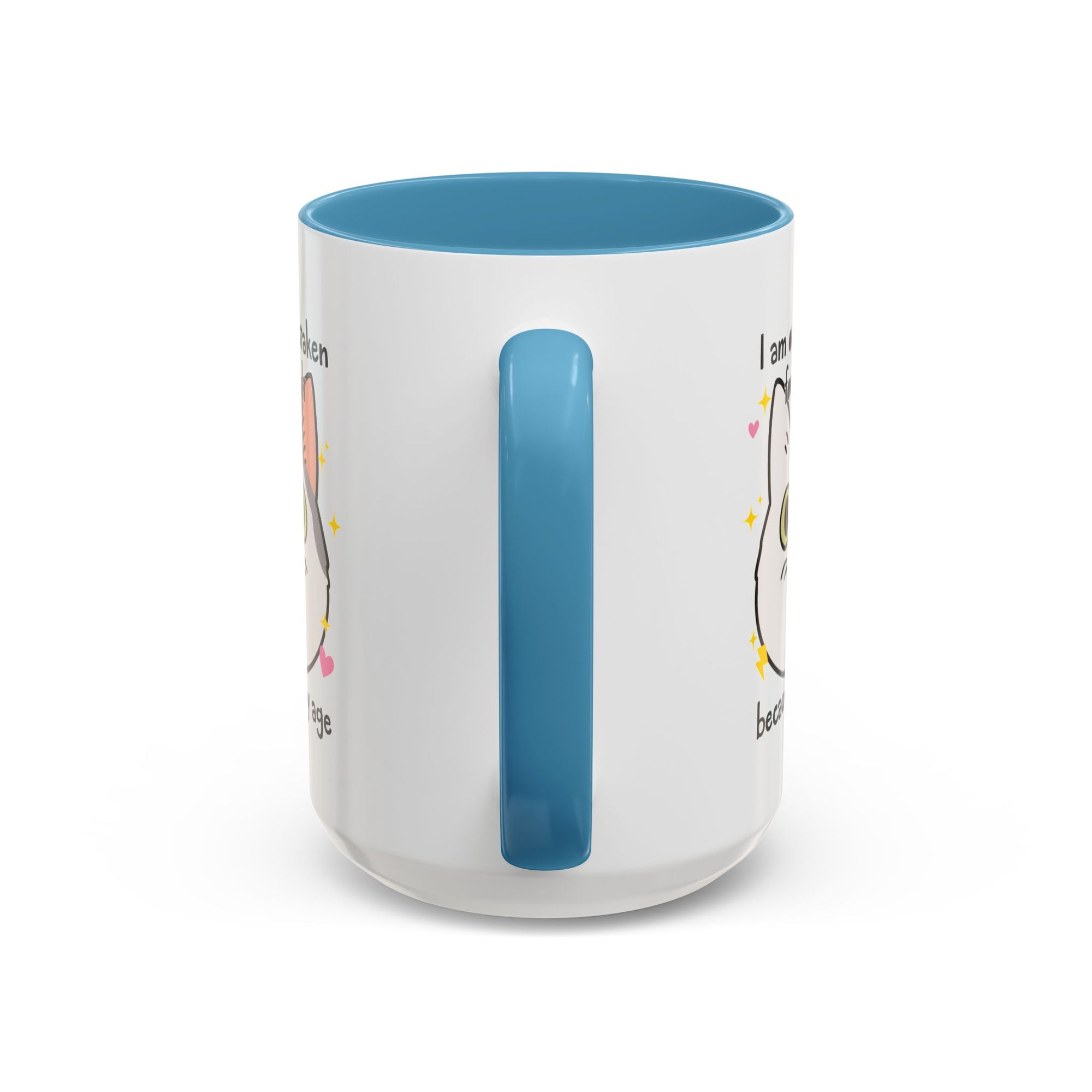 White ceramic mug with blue handle and interior featuring a cute wide-eyed cat face, hearts, sparkles, and the phrase “I am often mistaken for an adult because of my age.”
