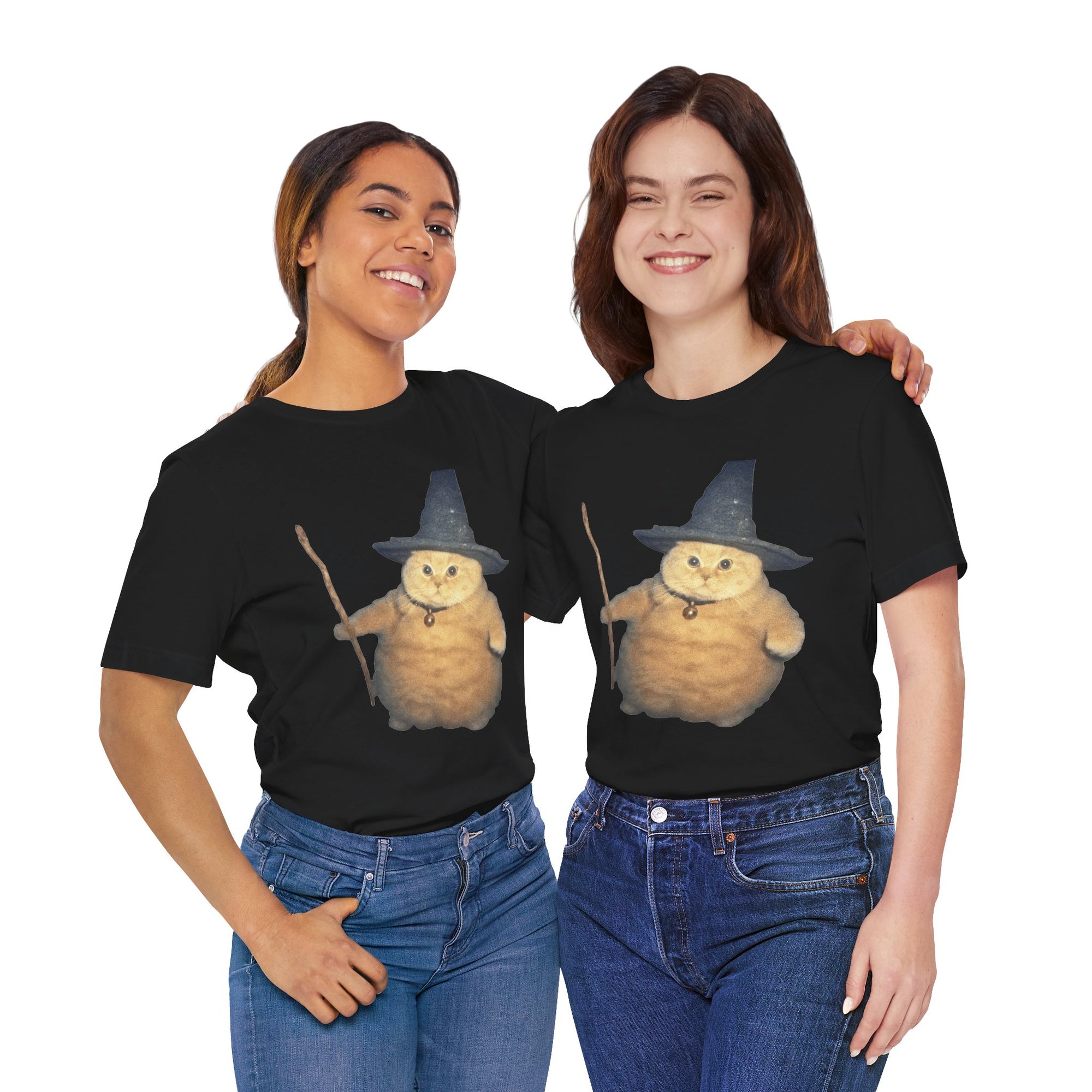 Two people wearing black t-shirts with a cartoon cat in a witch hat design on a white background.