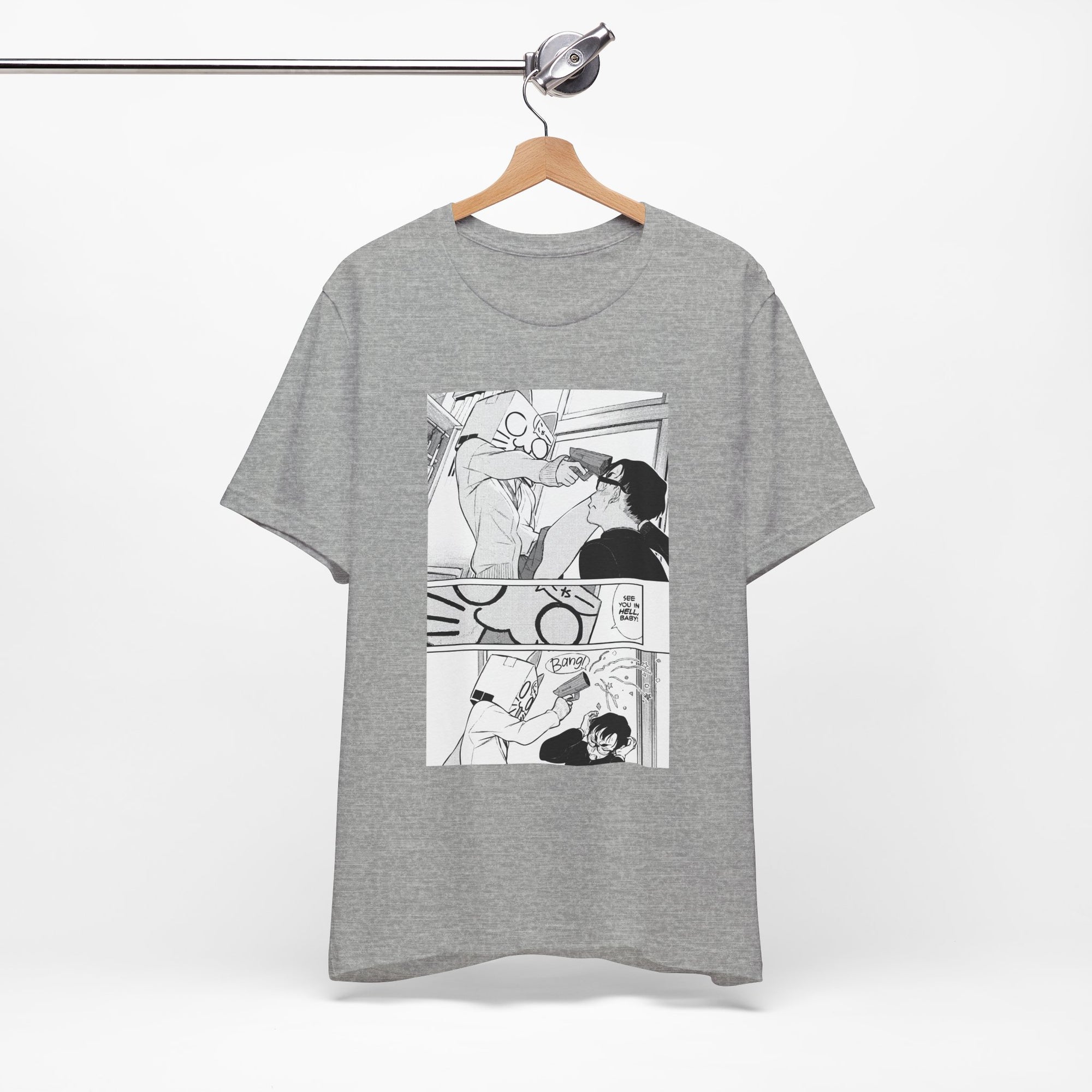 Gray t-shirt with comic-style graphic on a hanger against a white background