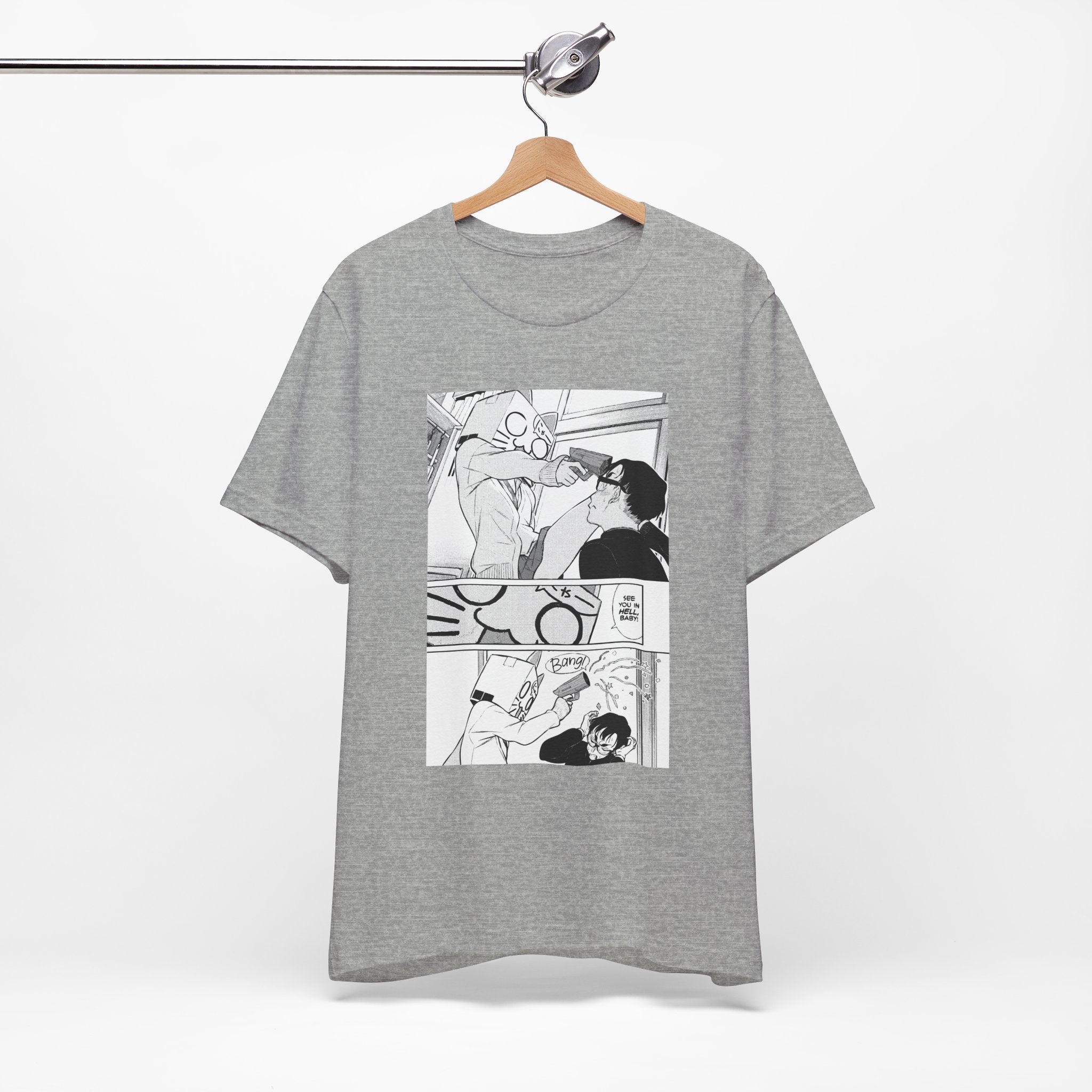 Gray t-shirt with comic-style graphic on a hanger against a white background