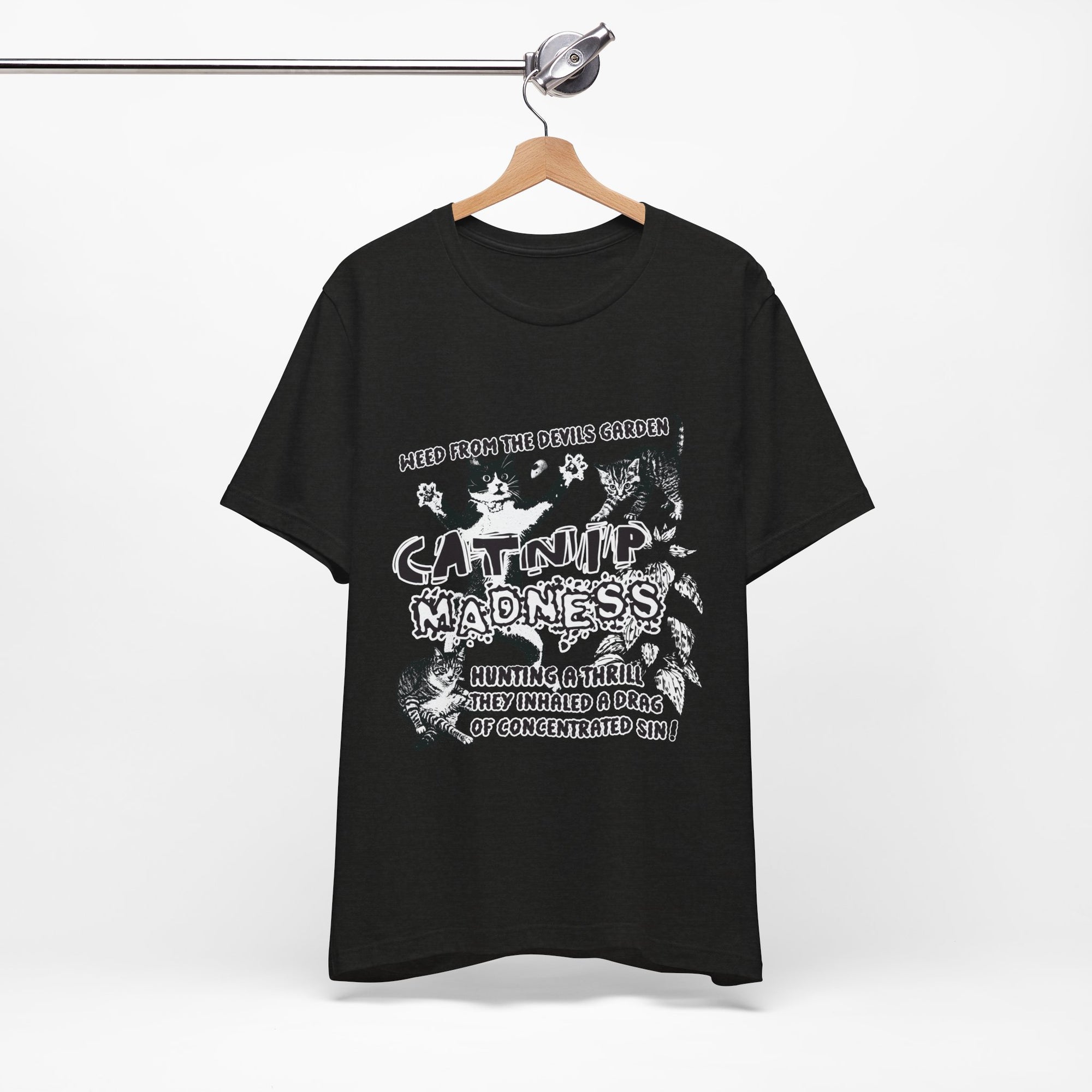 Black t-shirt with white graphic design on a hanger against a white background