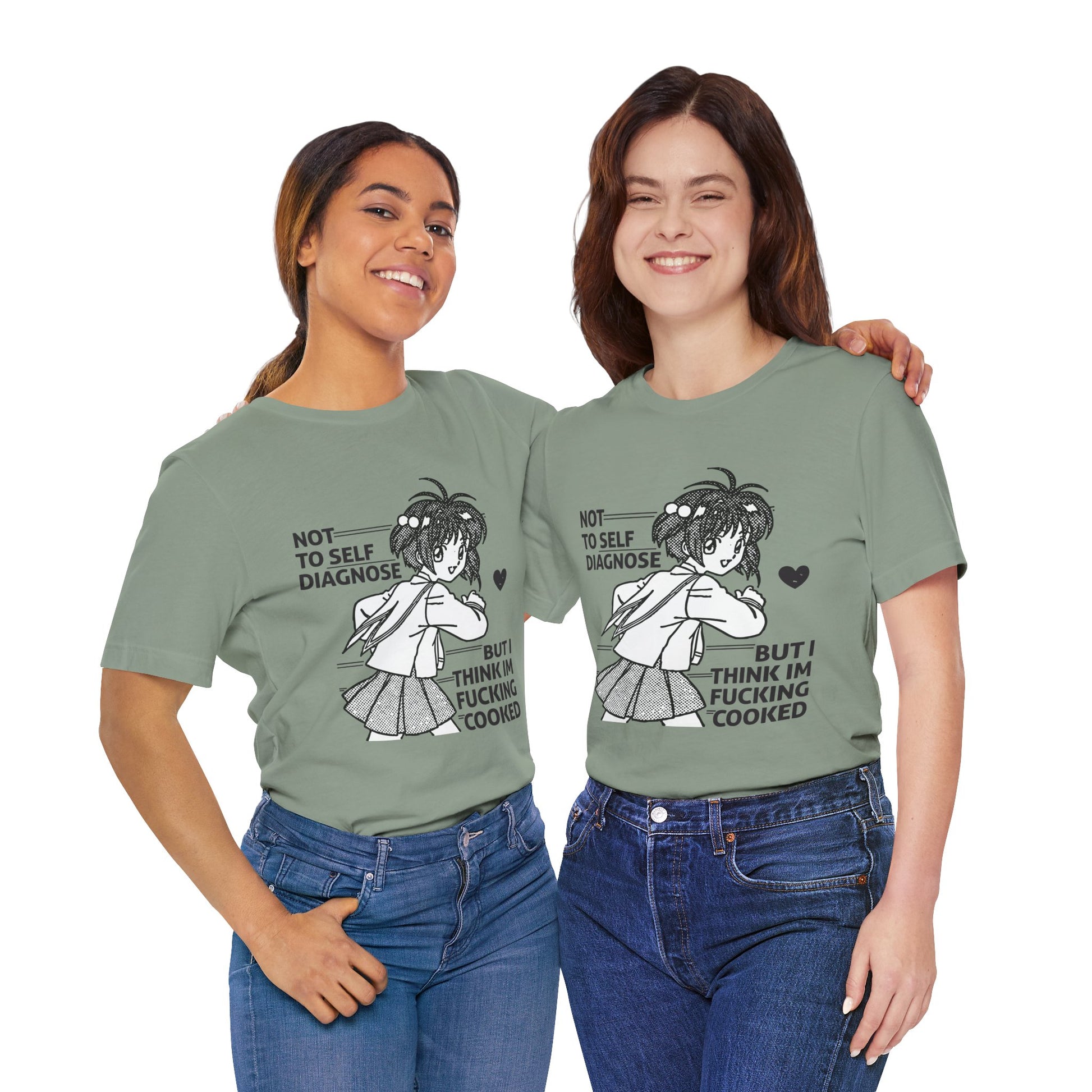 Two women wearing green t-shirts with a graphic and text, standing side by side against a white background.