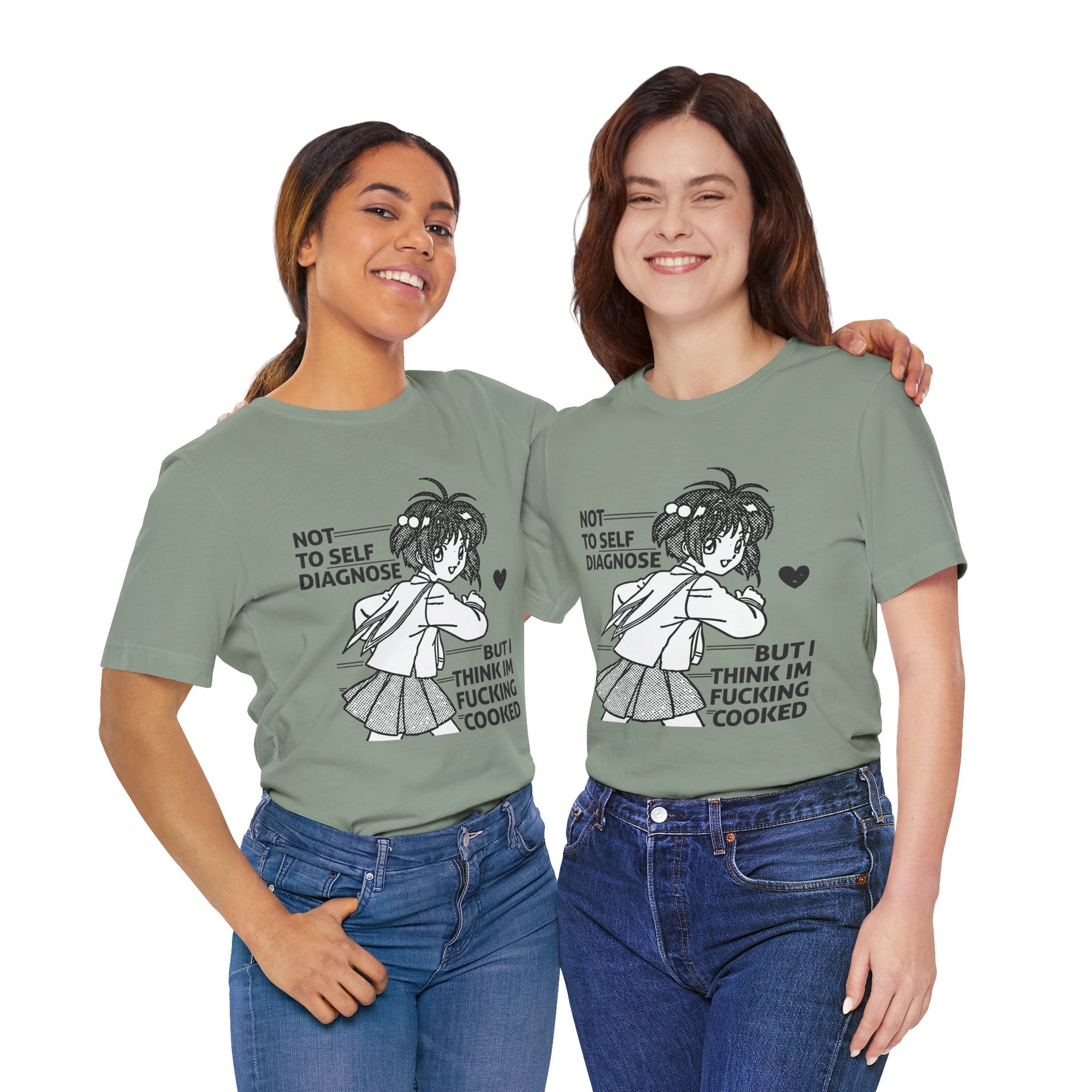 Two women wearing green t-shirts with a graphic and text, standing side by side against a white background.