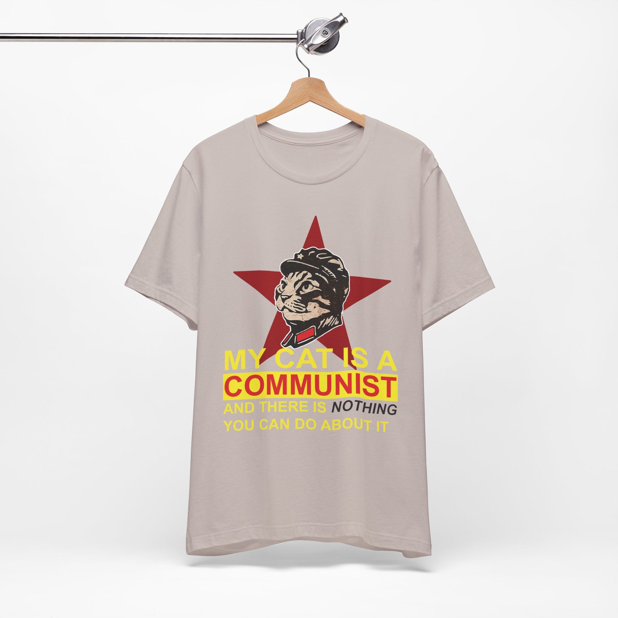 T-shirt with a graphic of a cat in a communist uniform and text on a beige background