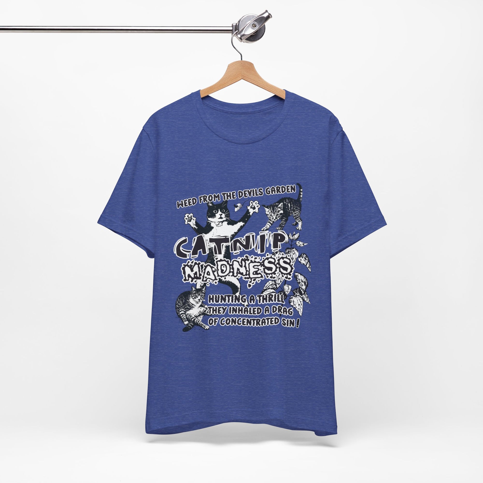 Blue t-shirt with graphic design and text on a hanger against a white background