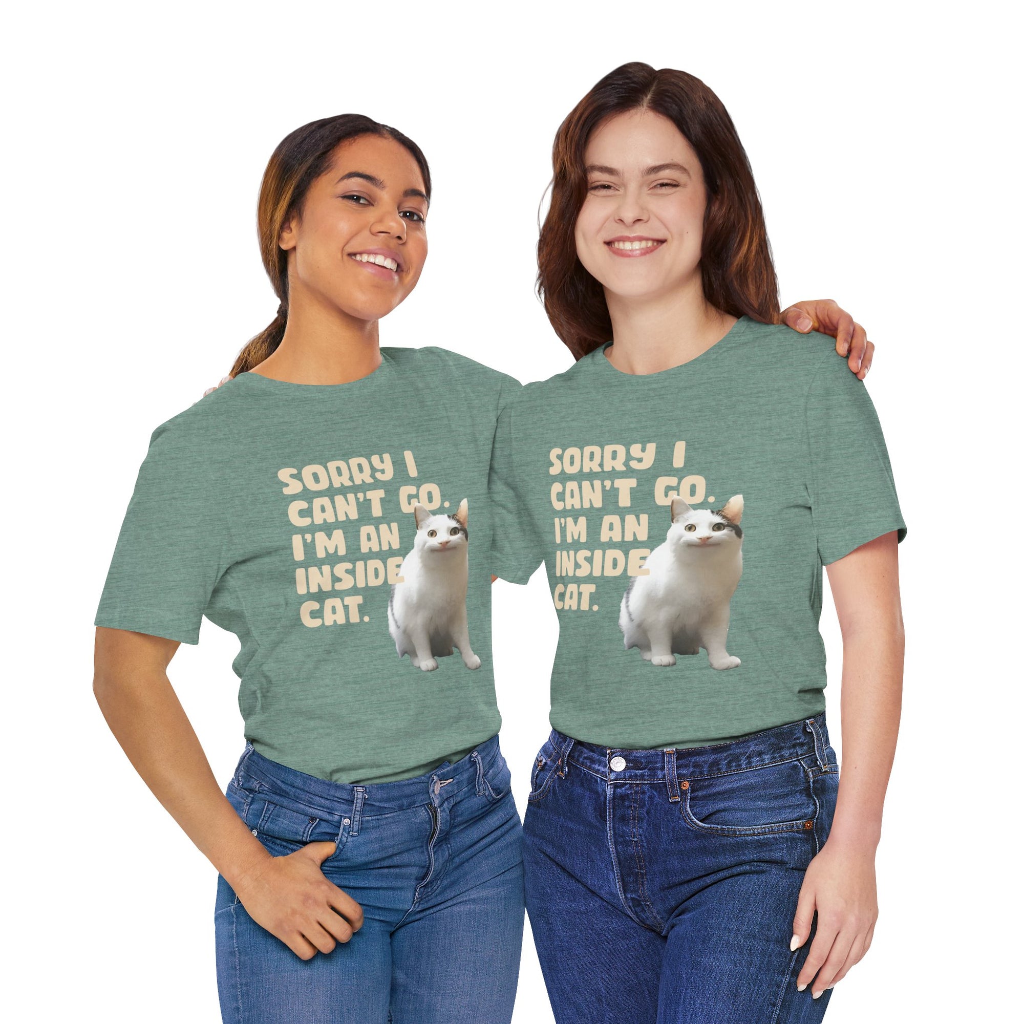 Two people wearing green t-shirts with a graphic of a cat and text, standing side by side against a white background.