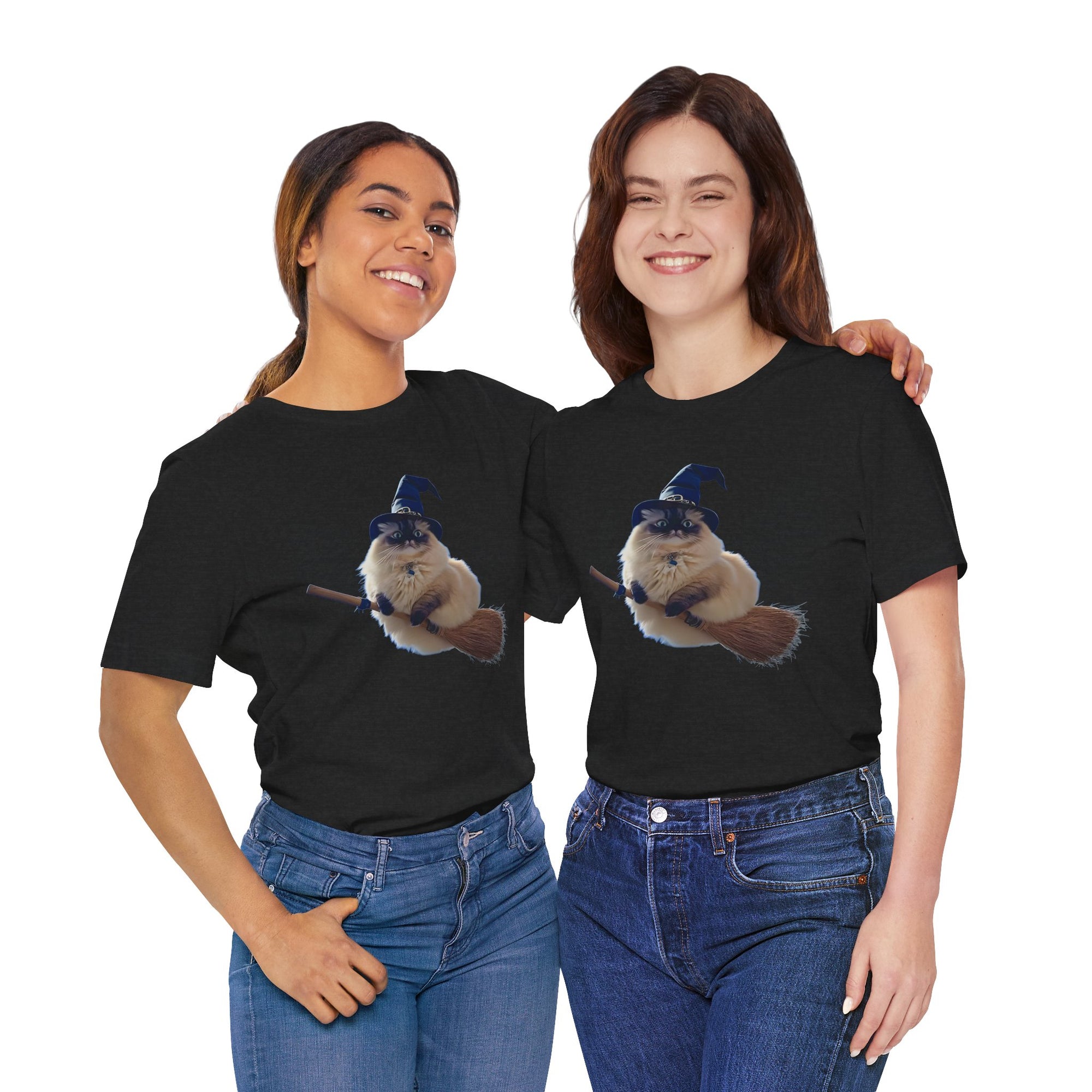 Two women wearing Black t-shirt featuring a fluffy cat wearing a blue witch hat and riding a broomstick.
