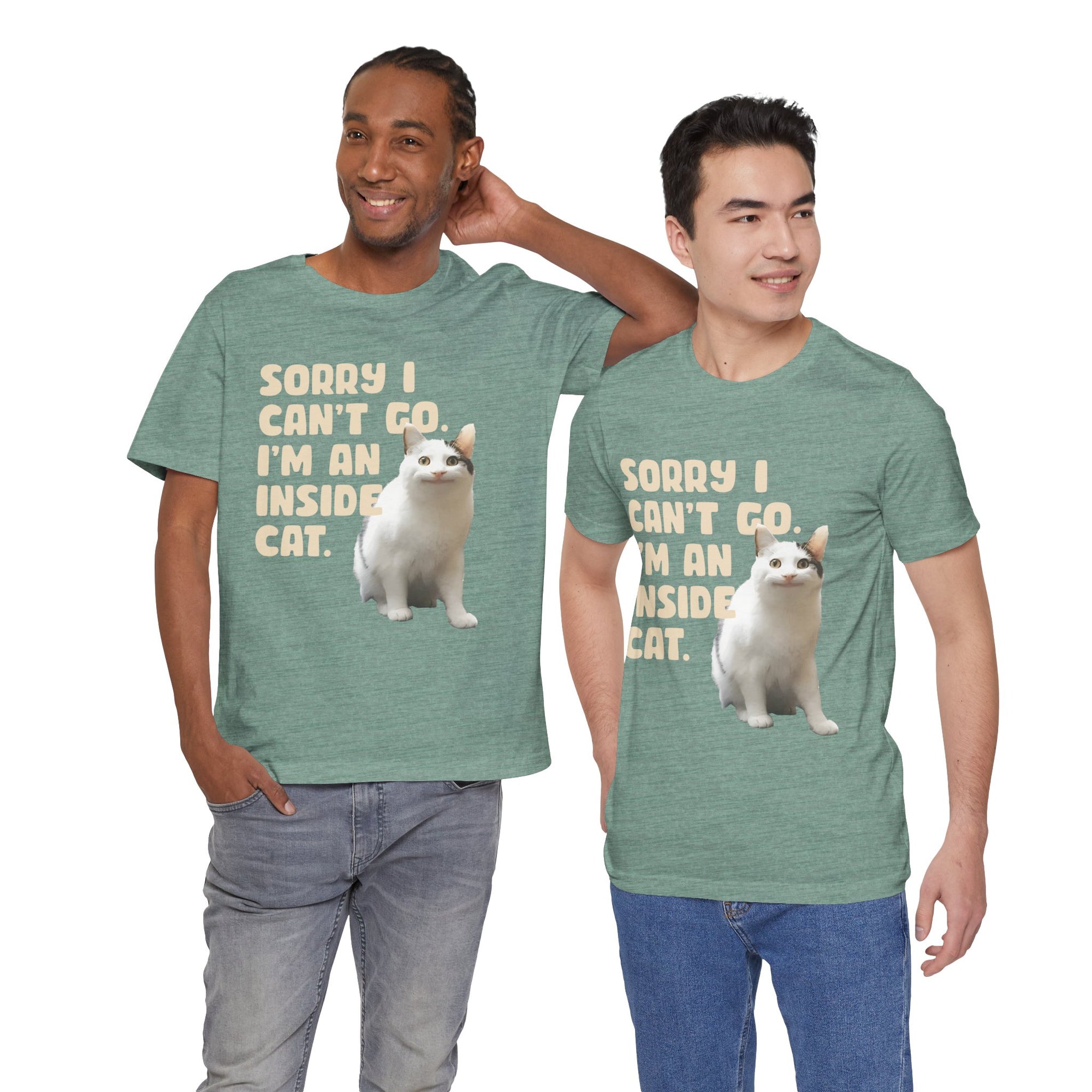 Two men wearing green t-shirts with a cat graphic and text.