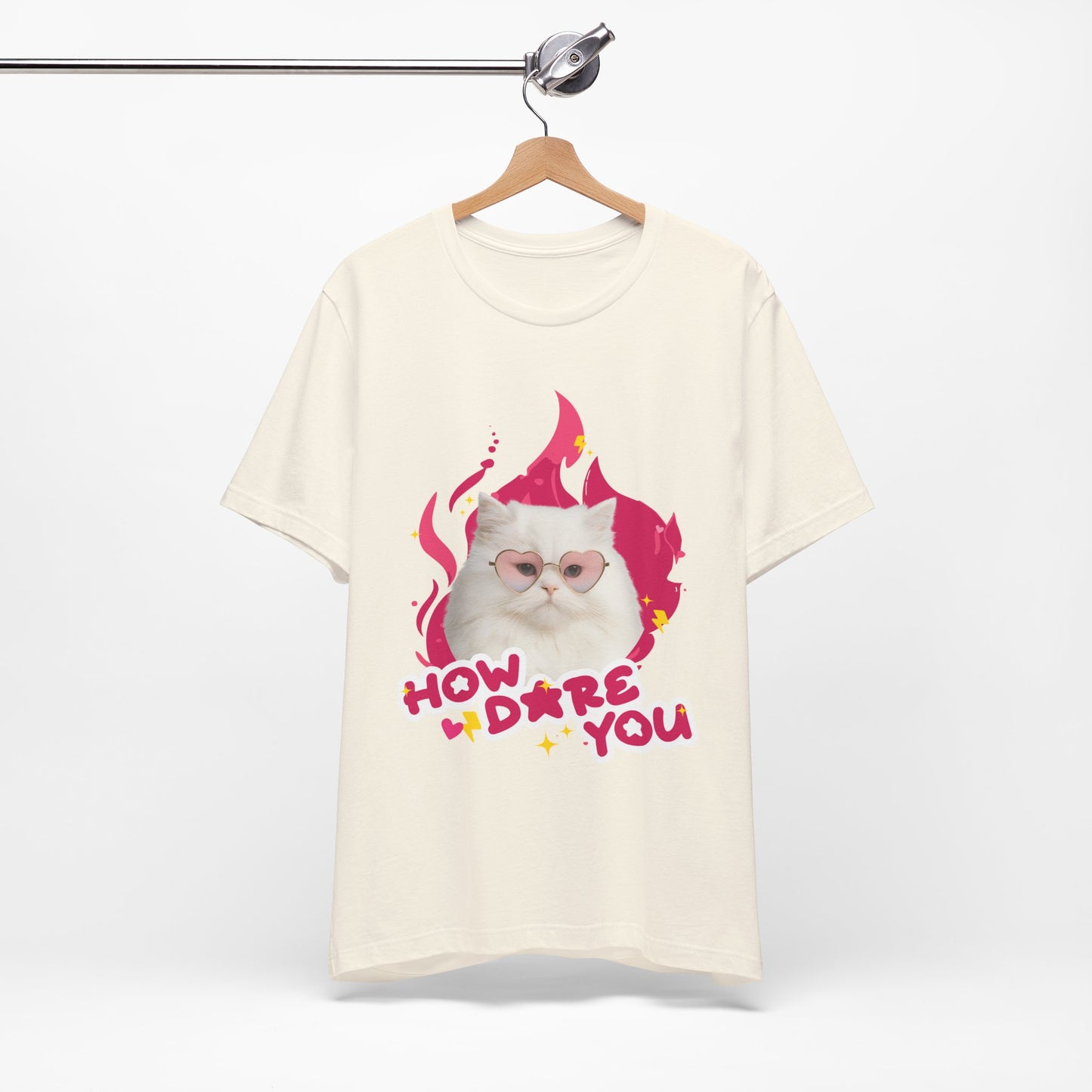 Beige t-shirt with a cat graphic and text on a white background