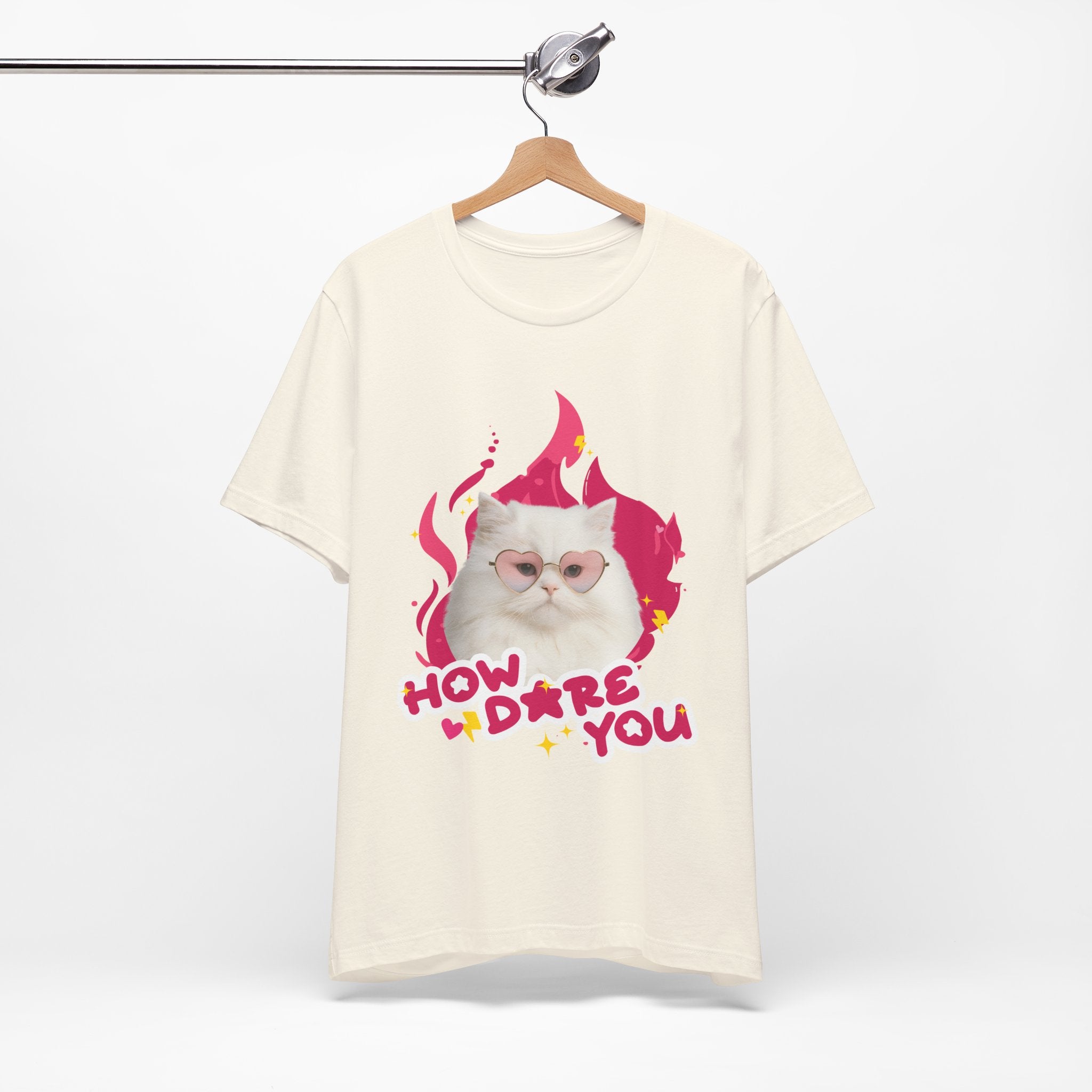 Beige t-shirt with a cat graphic and text on a white background