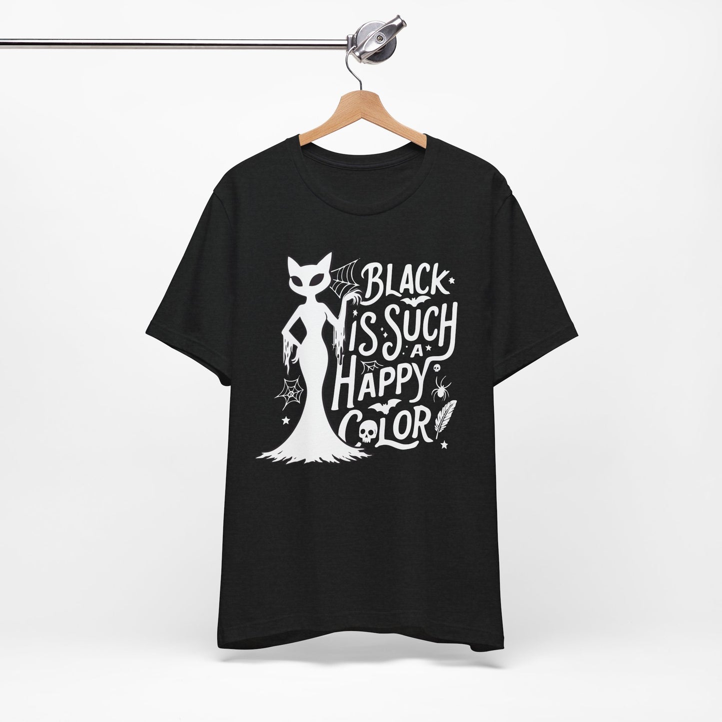 Black t-shirt featuring a white spooky cat graphic with the phrase “Black Is Such a Happy Color,” plus bats, spiderwebs, stars, and Halloween details.
