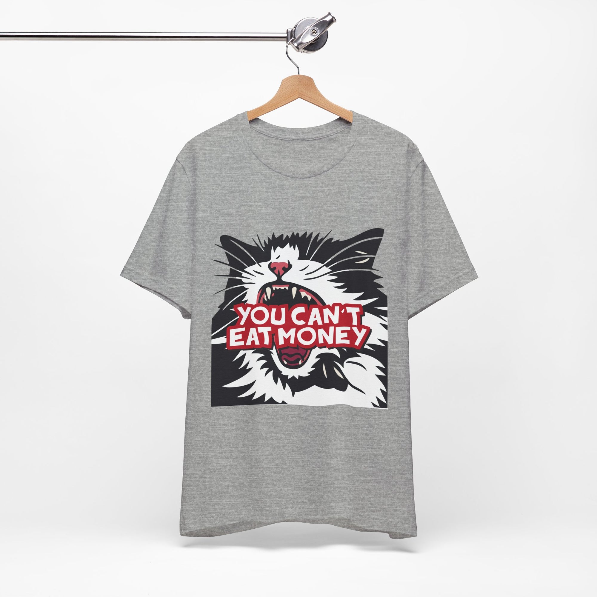 grey t-shirt featuring a bold black, white, and red angry cat graphic with the phrase “You Can’t Eat Money.”
