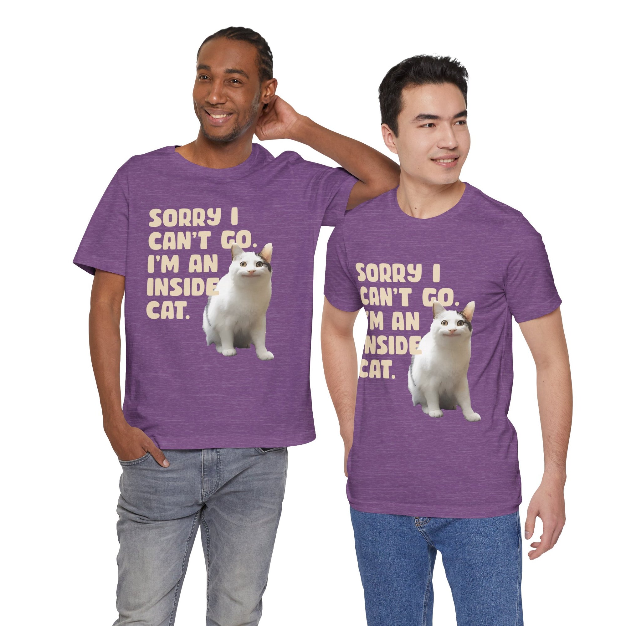 Two men wearing purple t-shirts with a cat graphic and text.