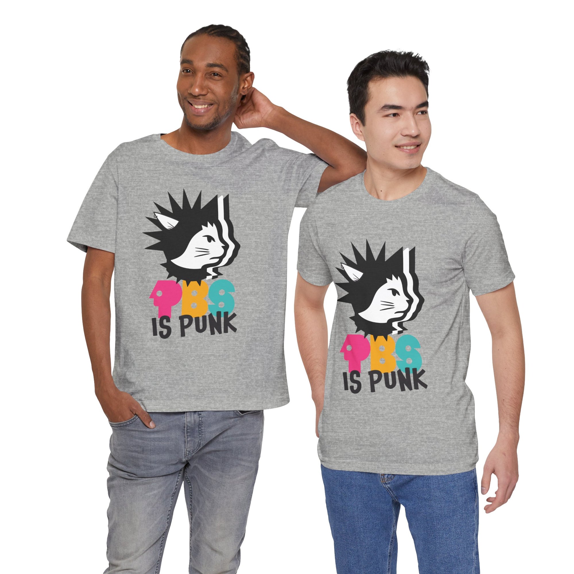 Two men wearing gray t-shirt featuring a punk-style black cat graphic with colorful letters spelling “PBG” and black text that says “Is Punk.”
