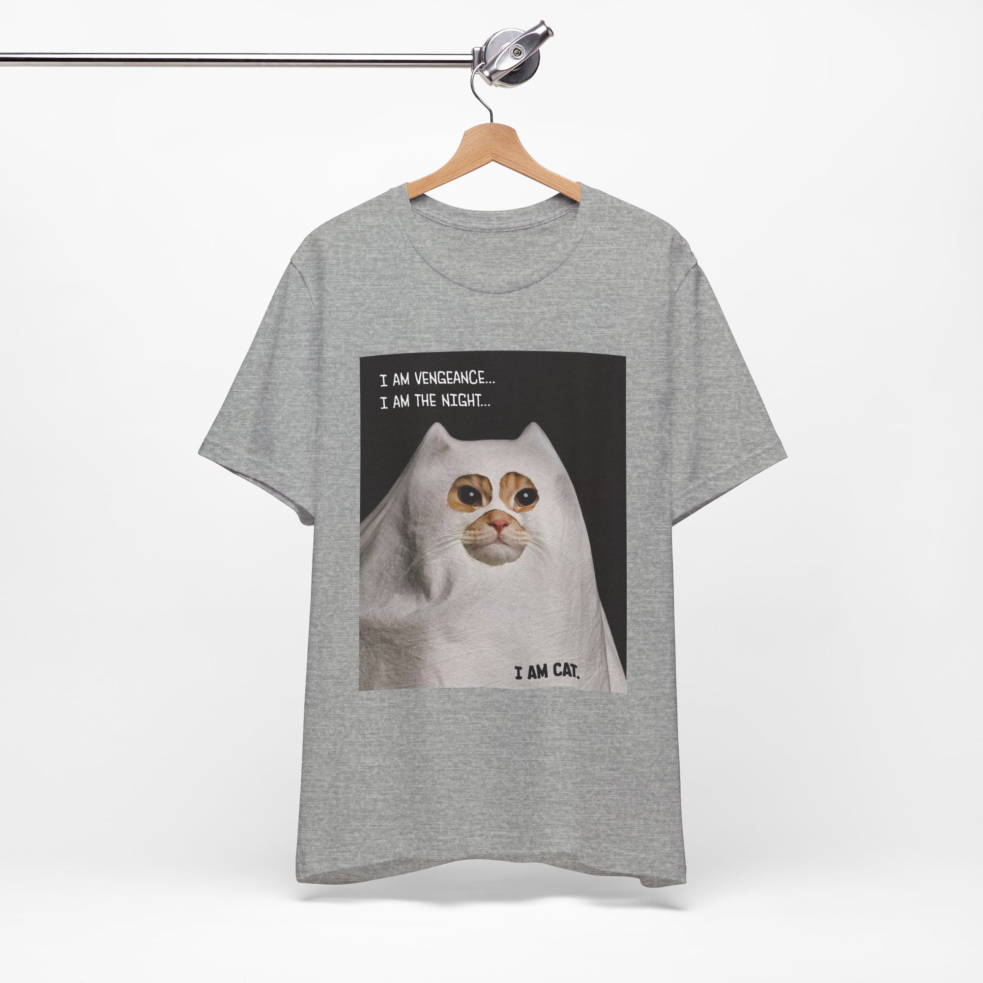 Gray t-shirt with a graphic of a cat and text on a hanger against a white background