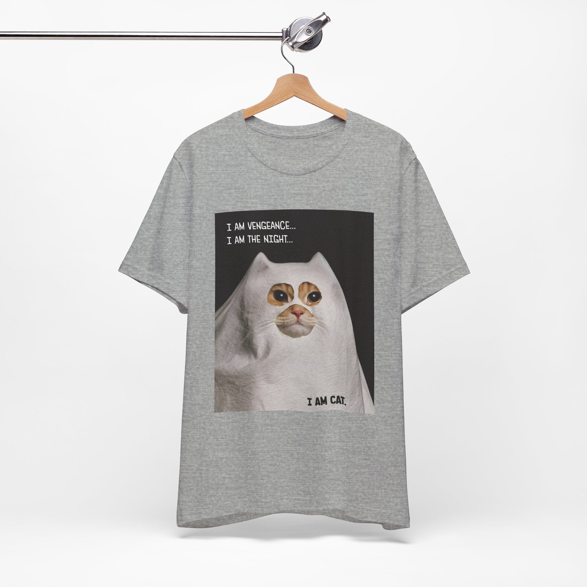 Gray t-shirt with a graphic of a cat and text on a hanger against a white background