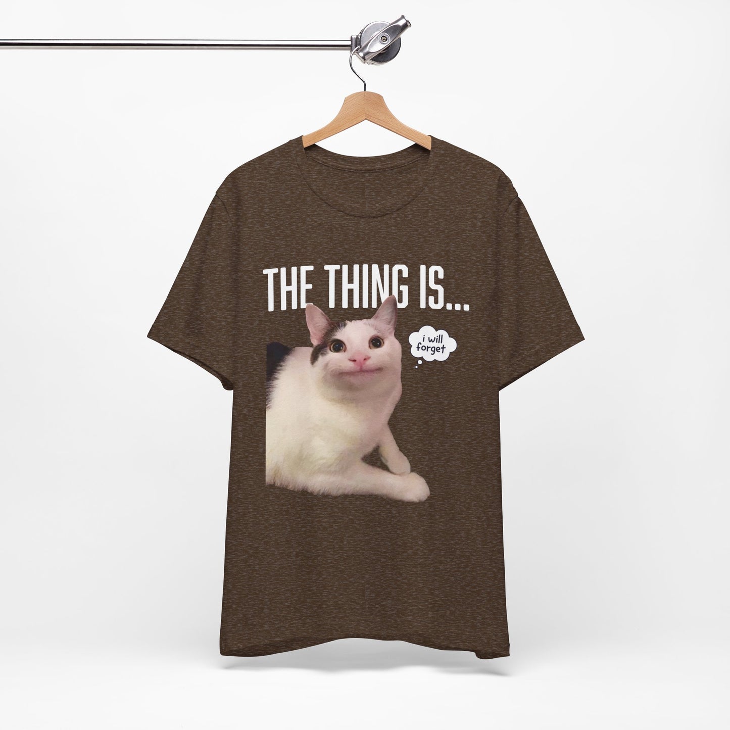 Black t-shirt with a cat graphic and text on a hanger against a white background