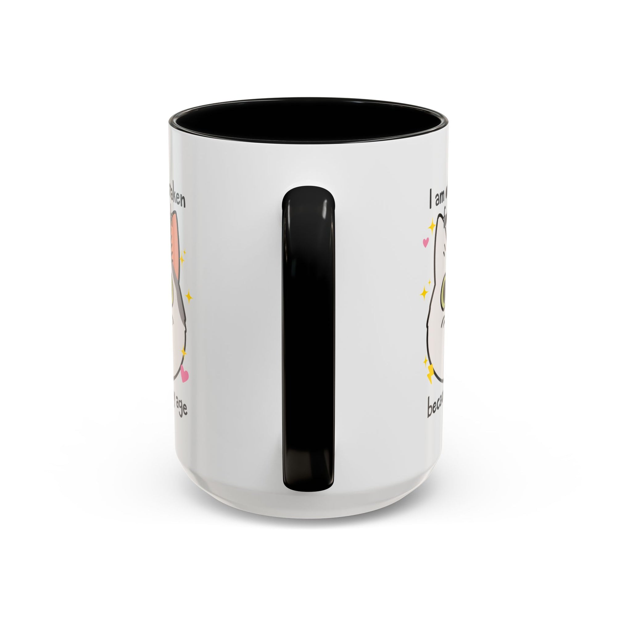 White ceramic mug with black handle and interior featuring a cute wide-eyed cat face, hearts, sparkles, and the phrase “I am often mistaken for an adult because of my age.”
