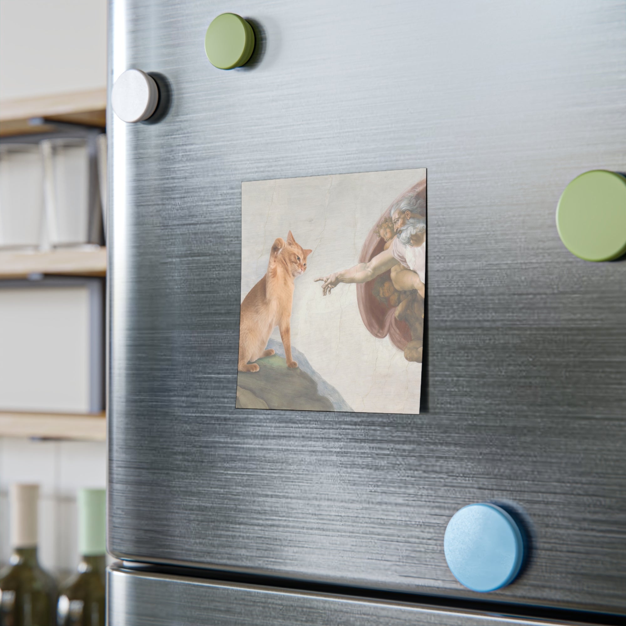Fridge with a Post-it notes featuring a classical painting of a cat and angel, surrounded by green and blue magnets.