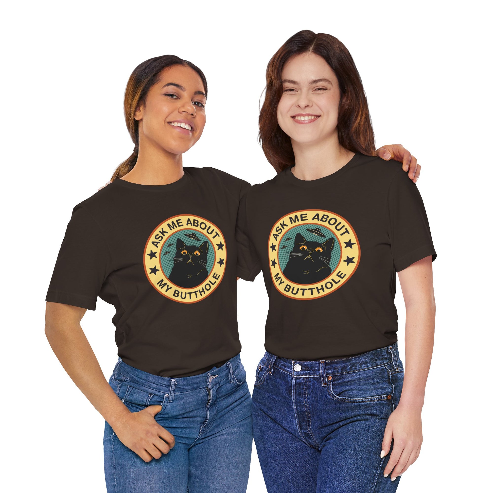Black t-shirt featuring a retro-style circular black cat badge with stars, bats, and the phrase “Ask Me About My Butthole.”
