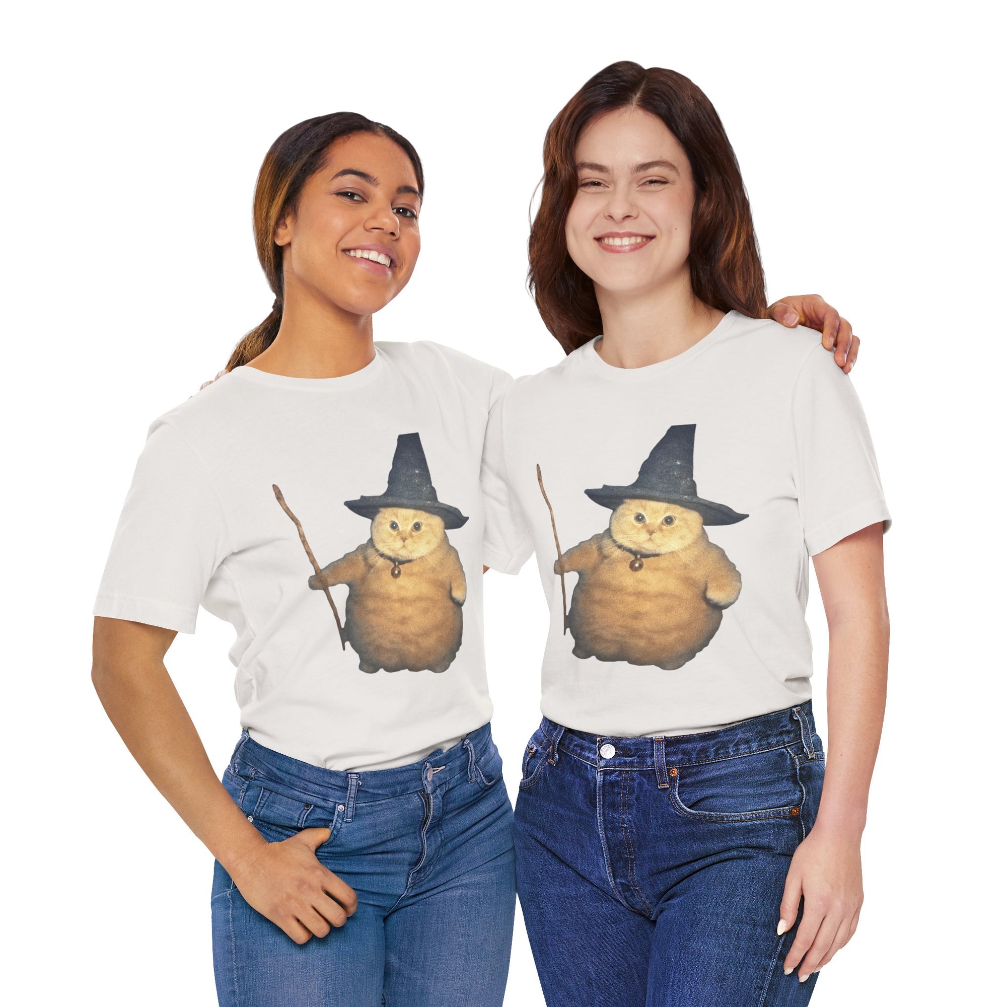 Two people wearing white t-shirts with a cartoon cat in a witch hat design on a white background