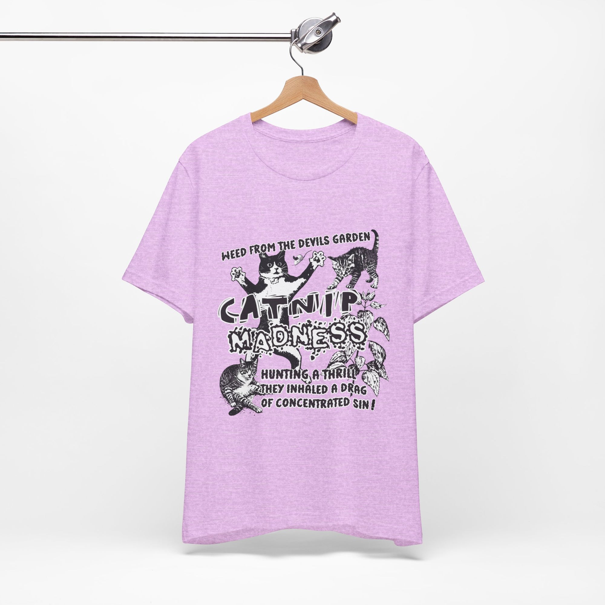 Purple t-shirt with graphic design and text on a hanger against a white background