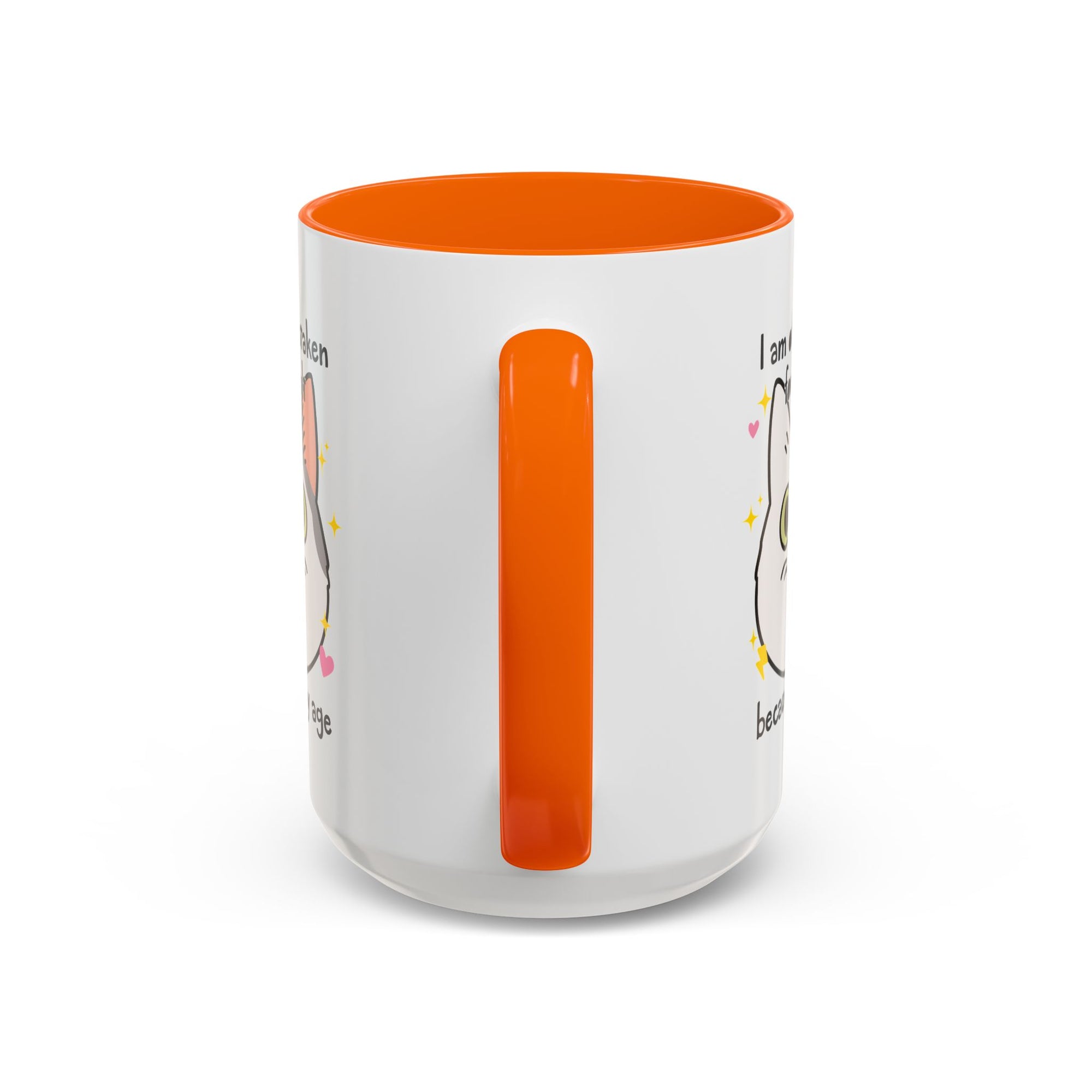 White ceramic mug with orange handle and interior featuring a cute wide-eyed cat face, hearts, sparkles, and the phrase “I am often mistaken for an adult because of my age.”
