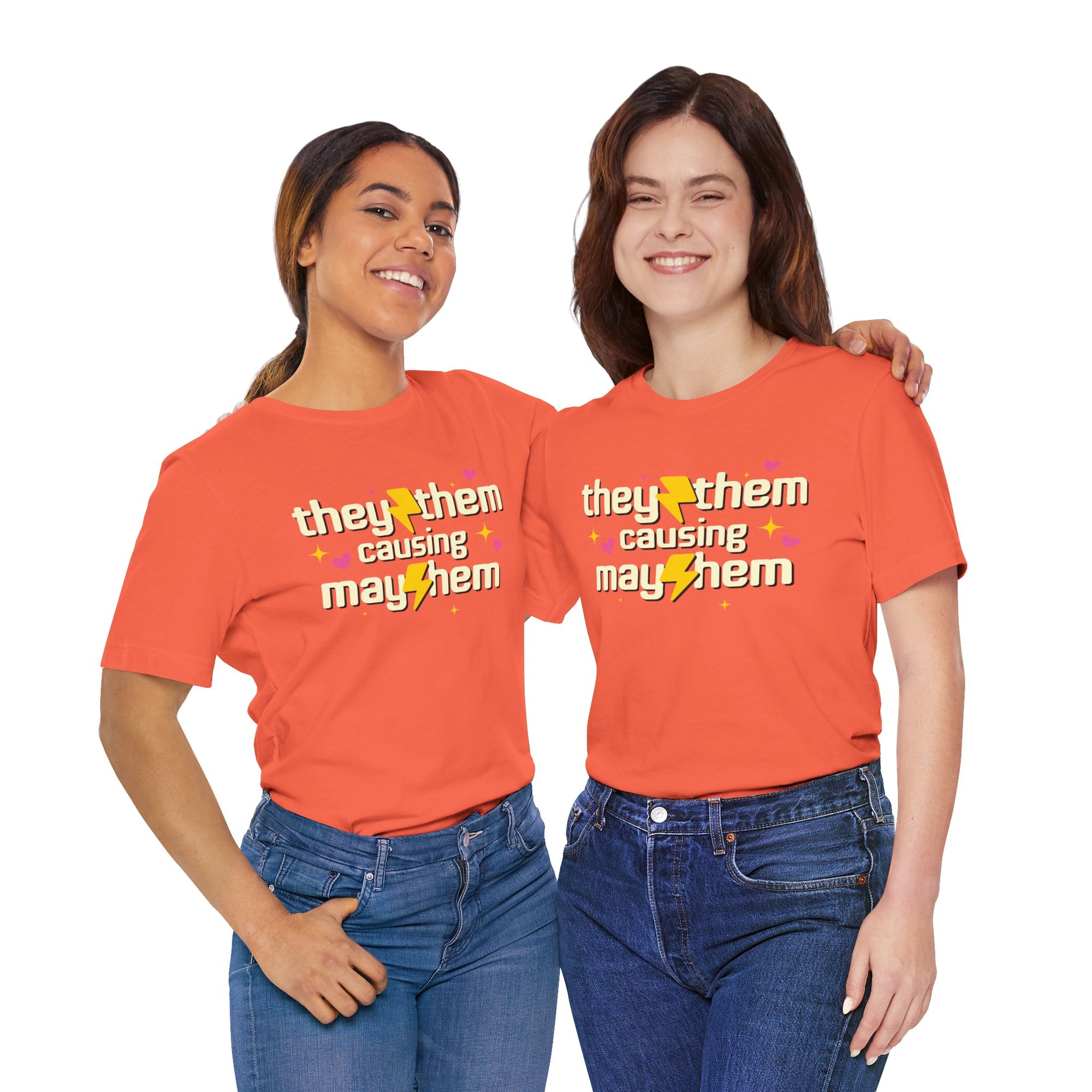 Two women wearing orange t-shirts with a design and text on a white background