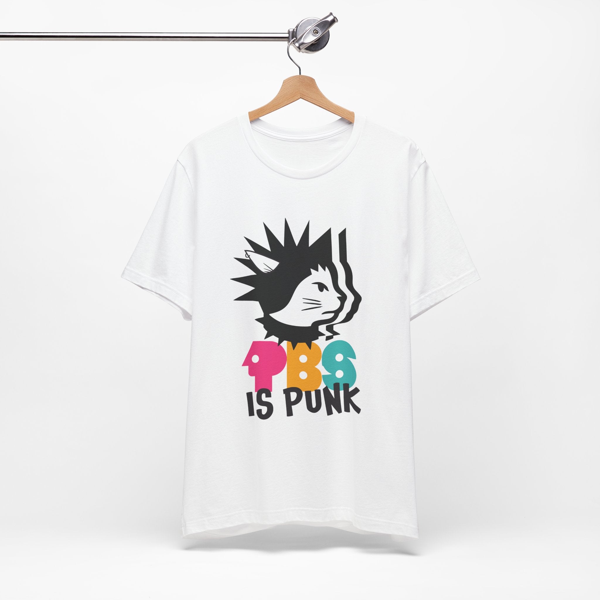 White t-shirt featuring a punk-style black cat graphic with colorful letters spelling “PBG” and black text that says “Is Punk.”

