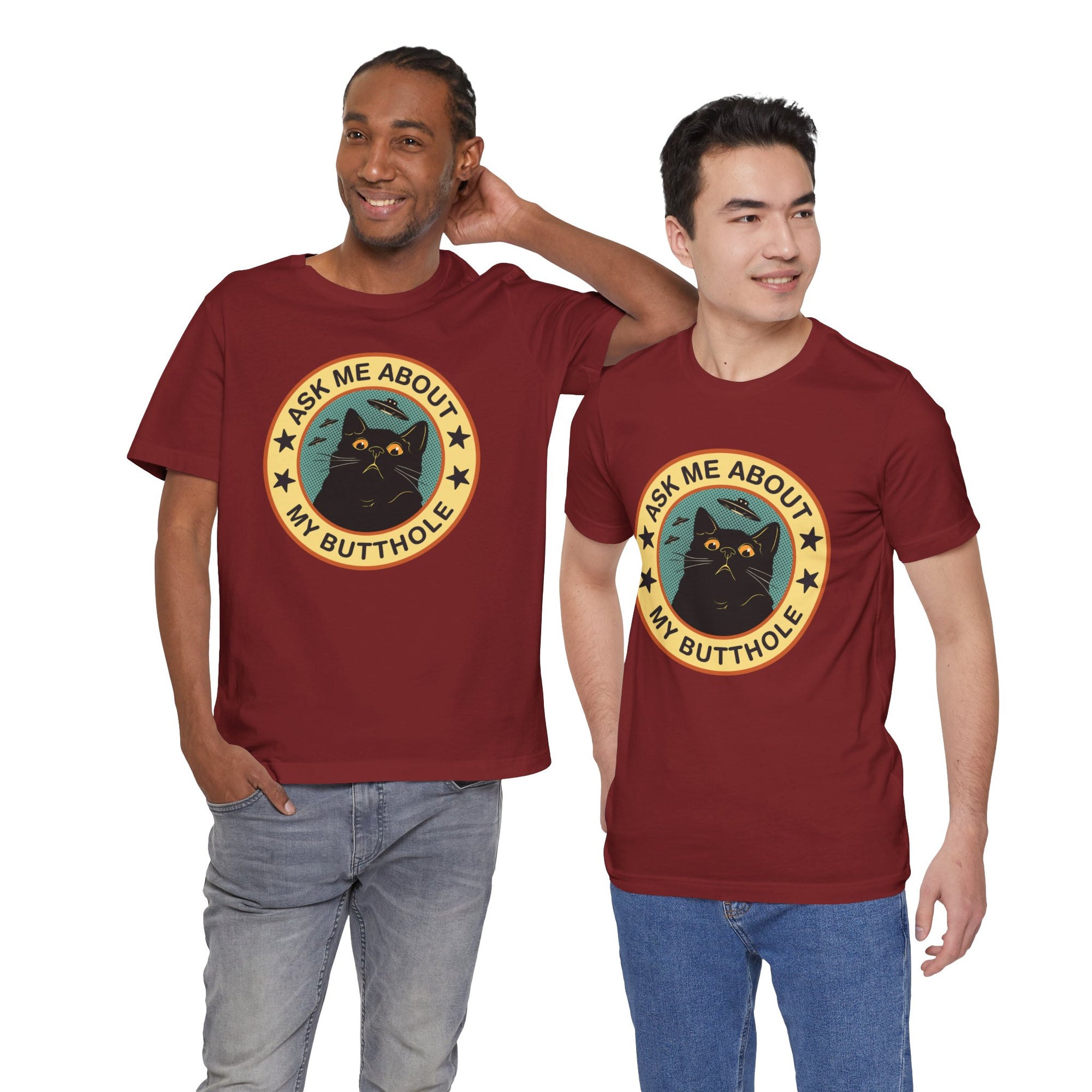 Two men wearing maroon t-shirts with a black cat graphic and text.