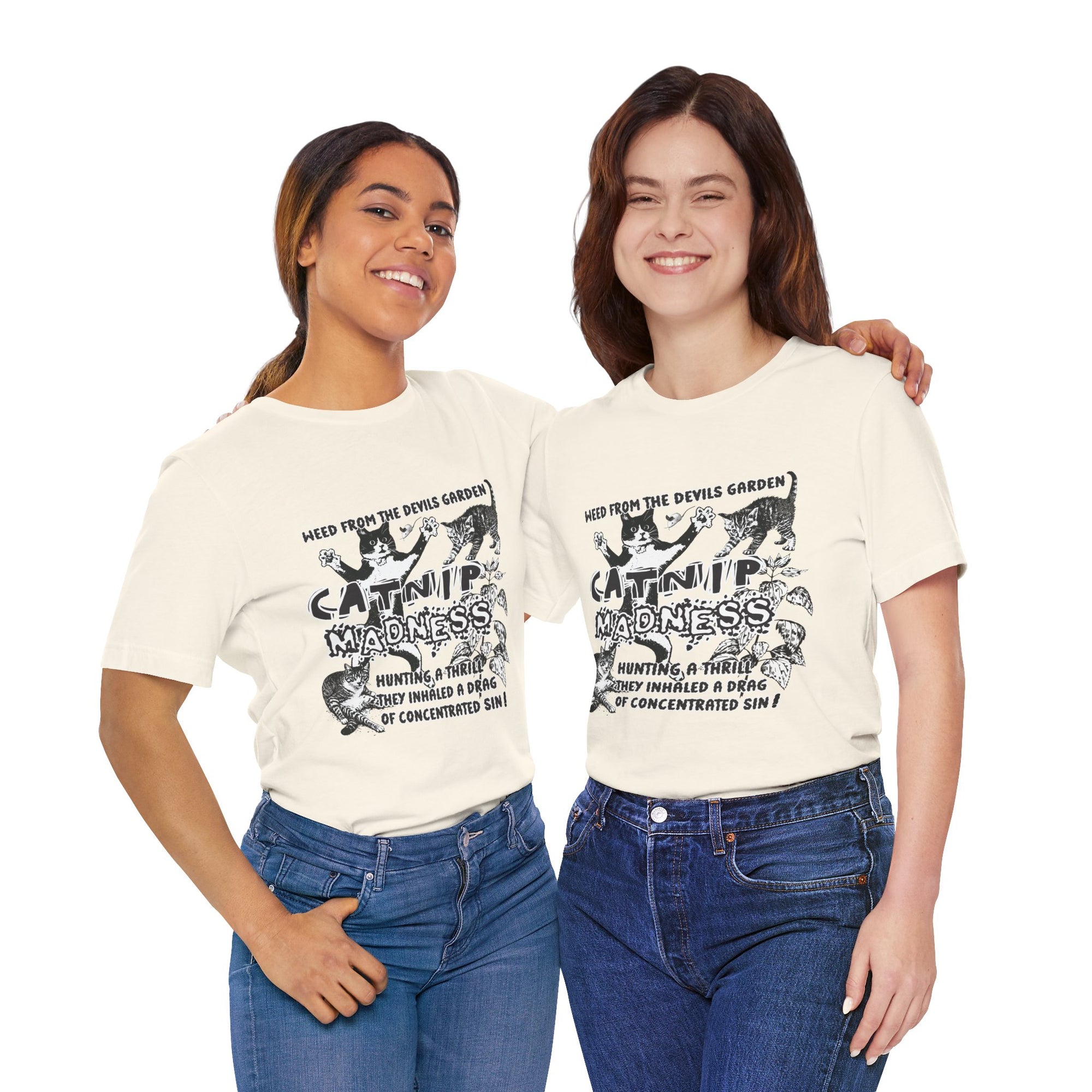 Two women wearing white t-shirts with black graphics on a white background