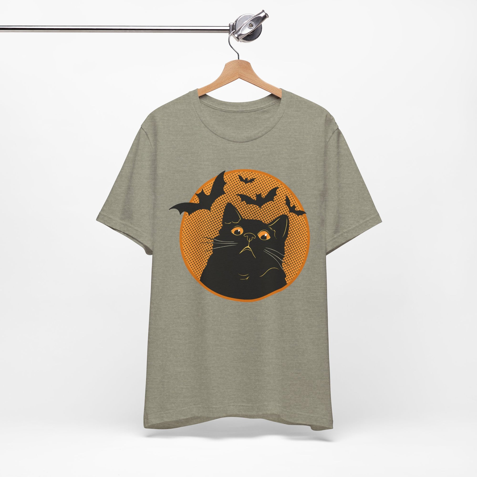 Grey t-shirt featuring a retro-style black cat graphic with orange moon, flying bats, and Halloween-inspired details.