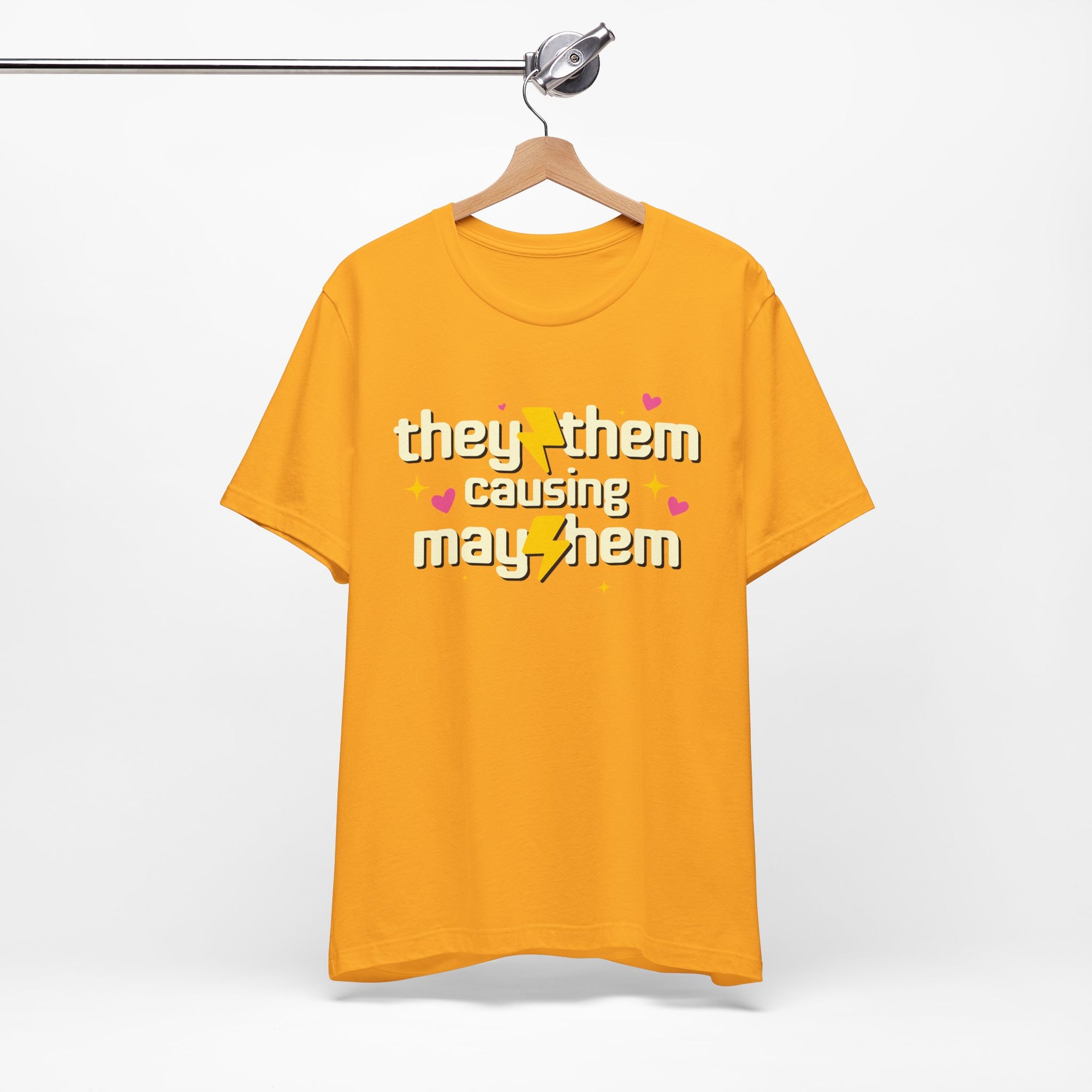 Yellow t-shirt with text on a hanger against a white background
