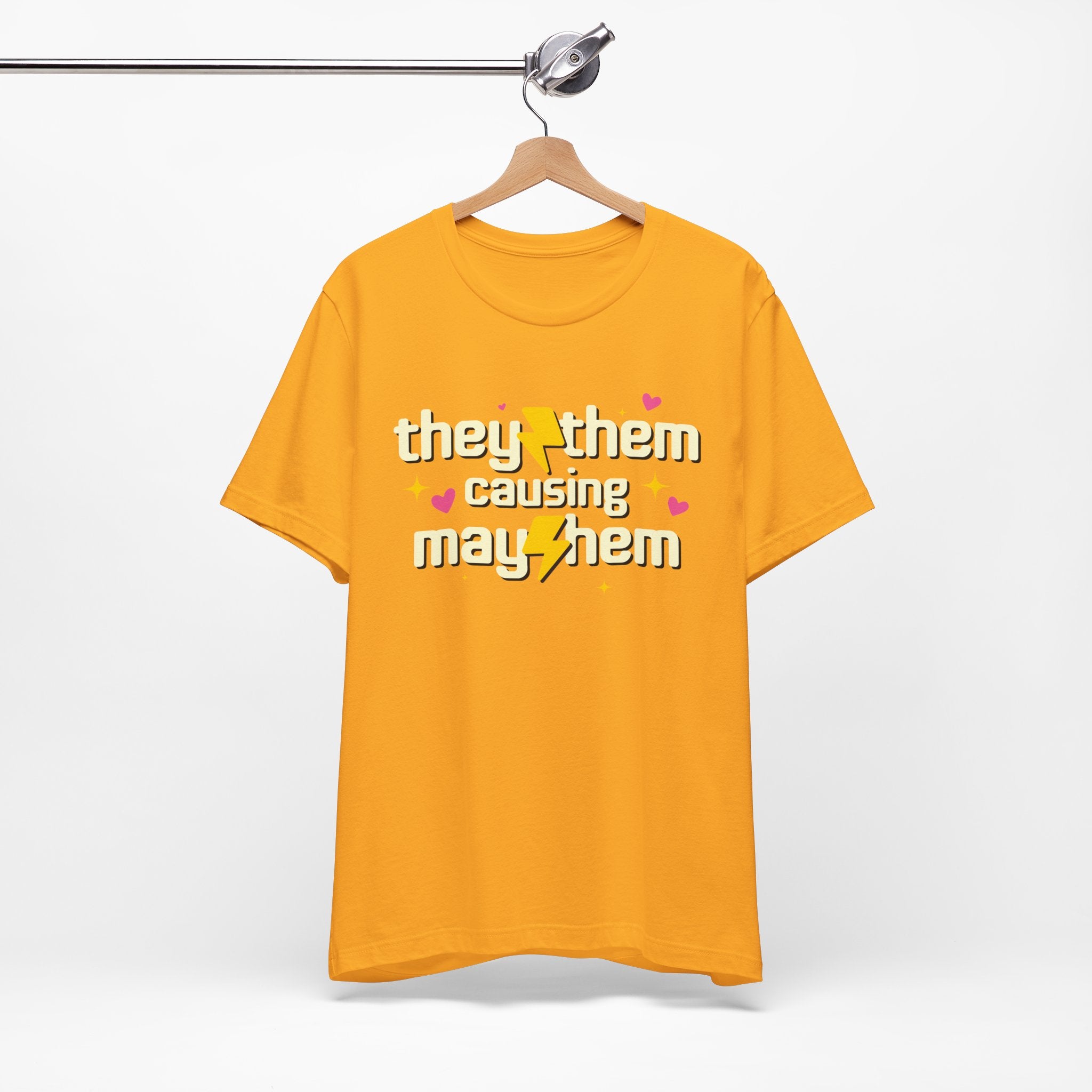 Yellow t-shirt with text on a hanger against a white background