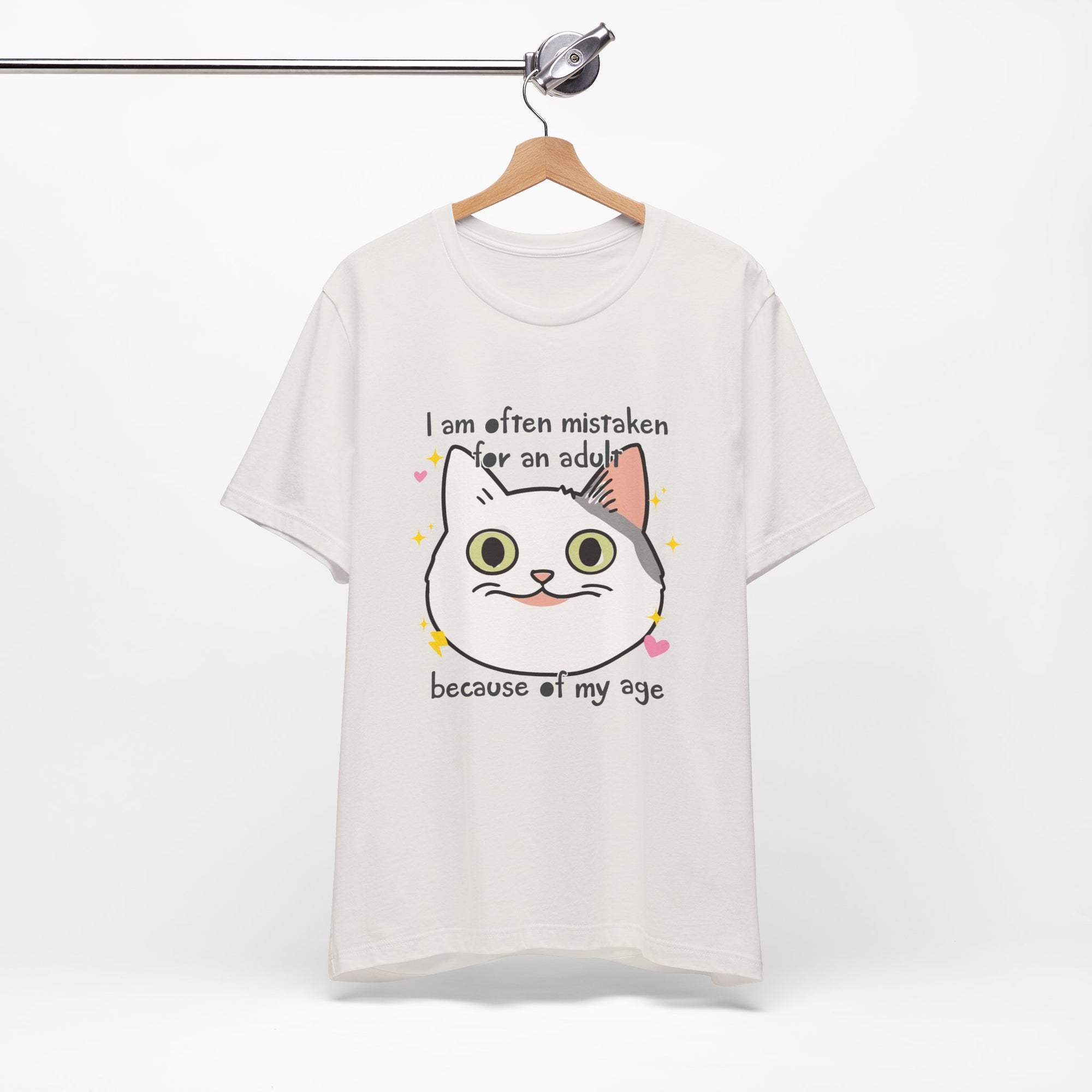 White t-shirt with a cat graphic and text on a white background