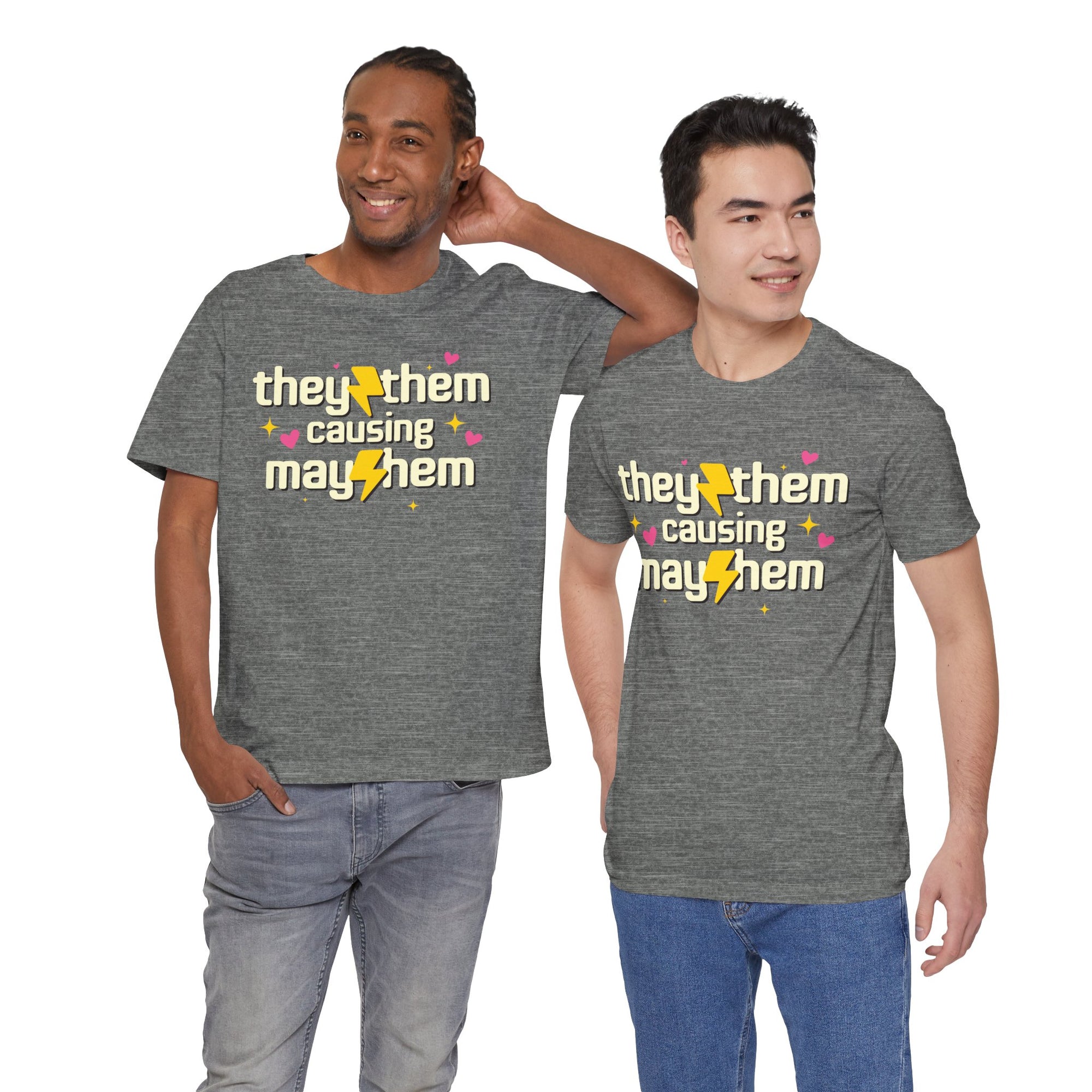 Two people wearing gray t-shirts with 'they/them causing mayhem' text.