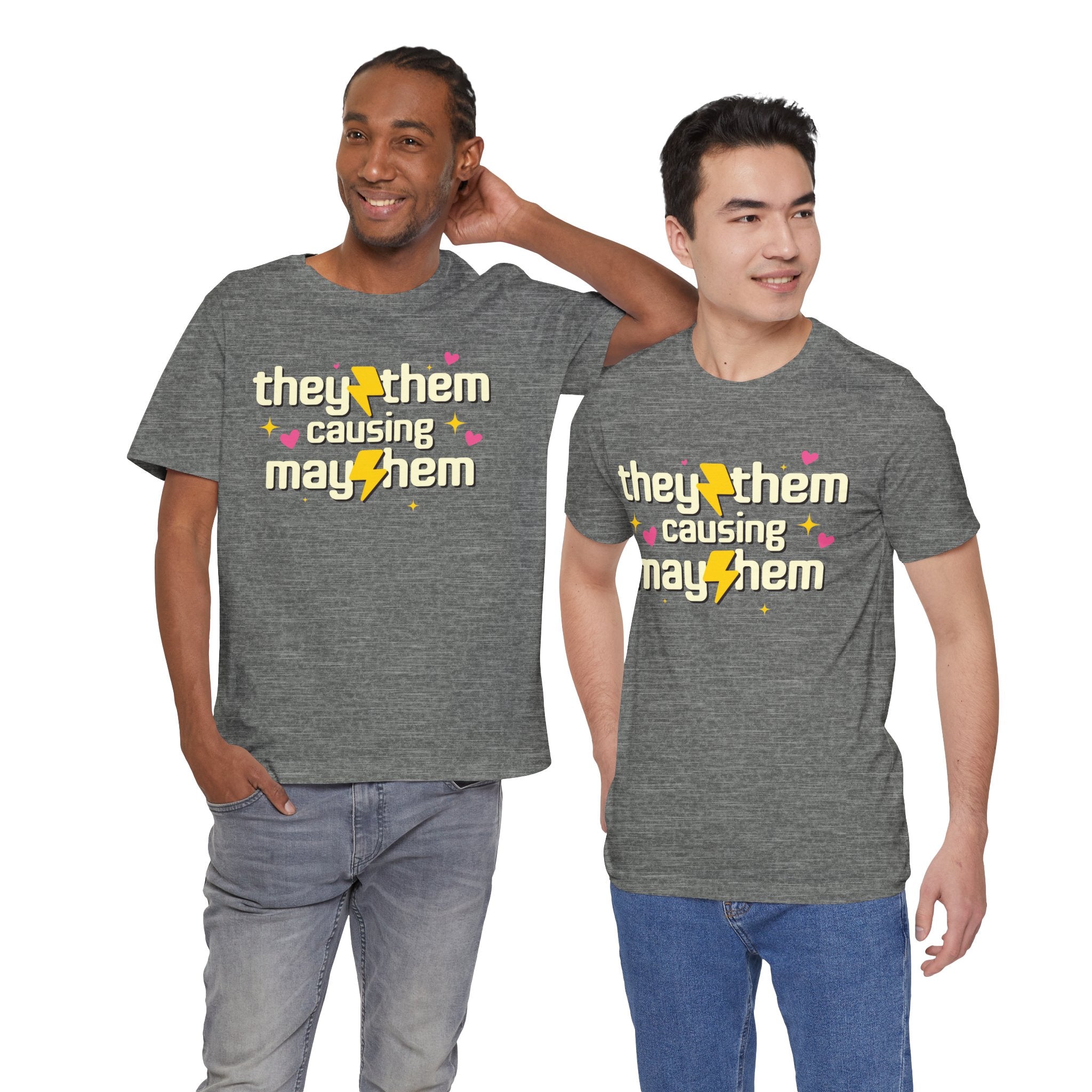 Two people wearing gray t-shirts with 'they/them causing mayhem' text.