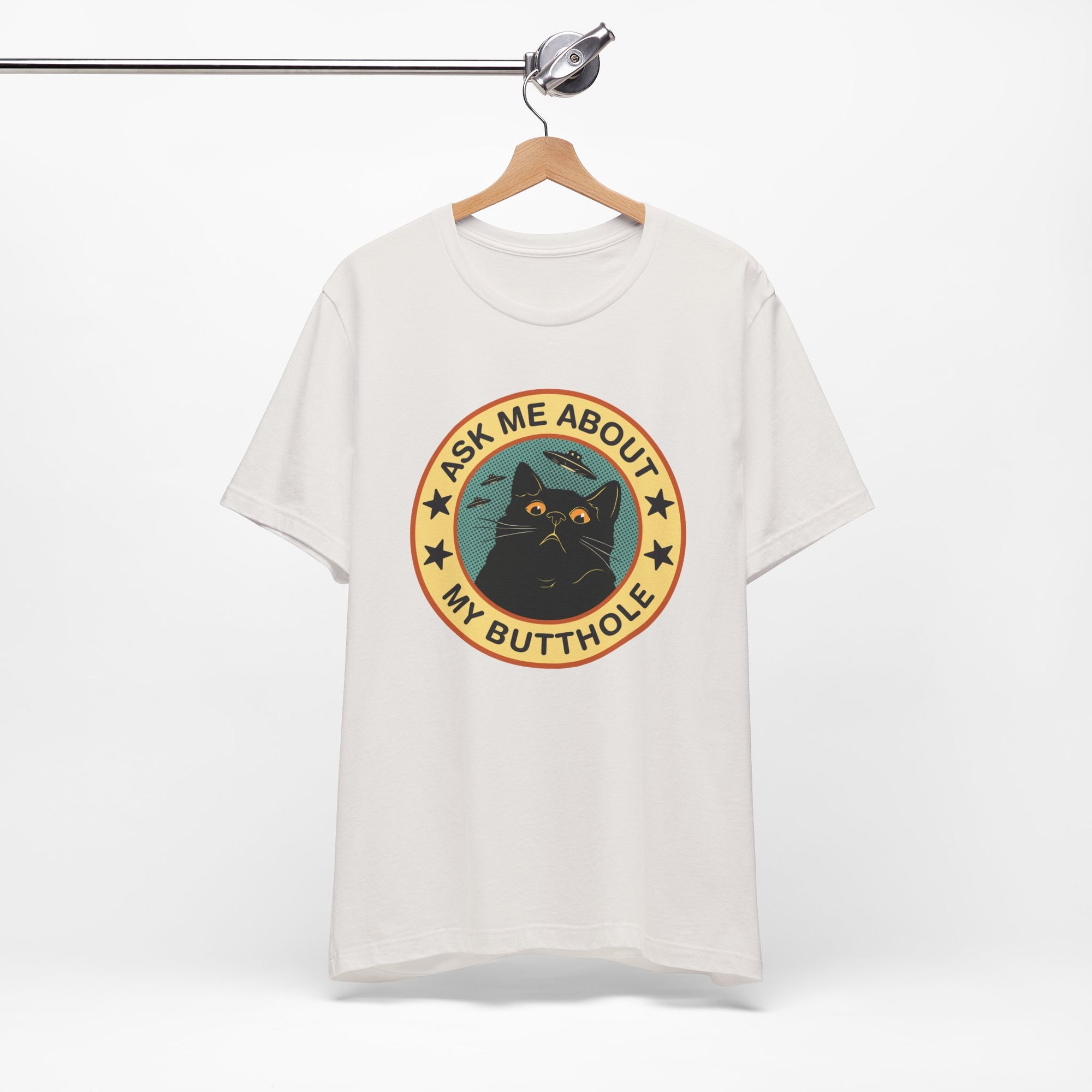 White t-shirt with a graphic of a cat and text 'Ask me about my butthole' on a white background