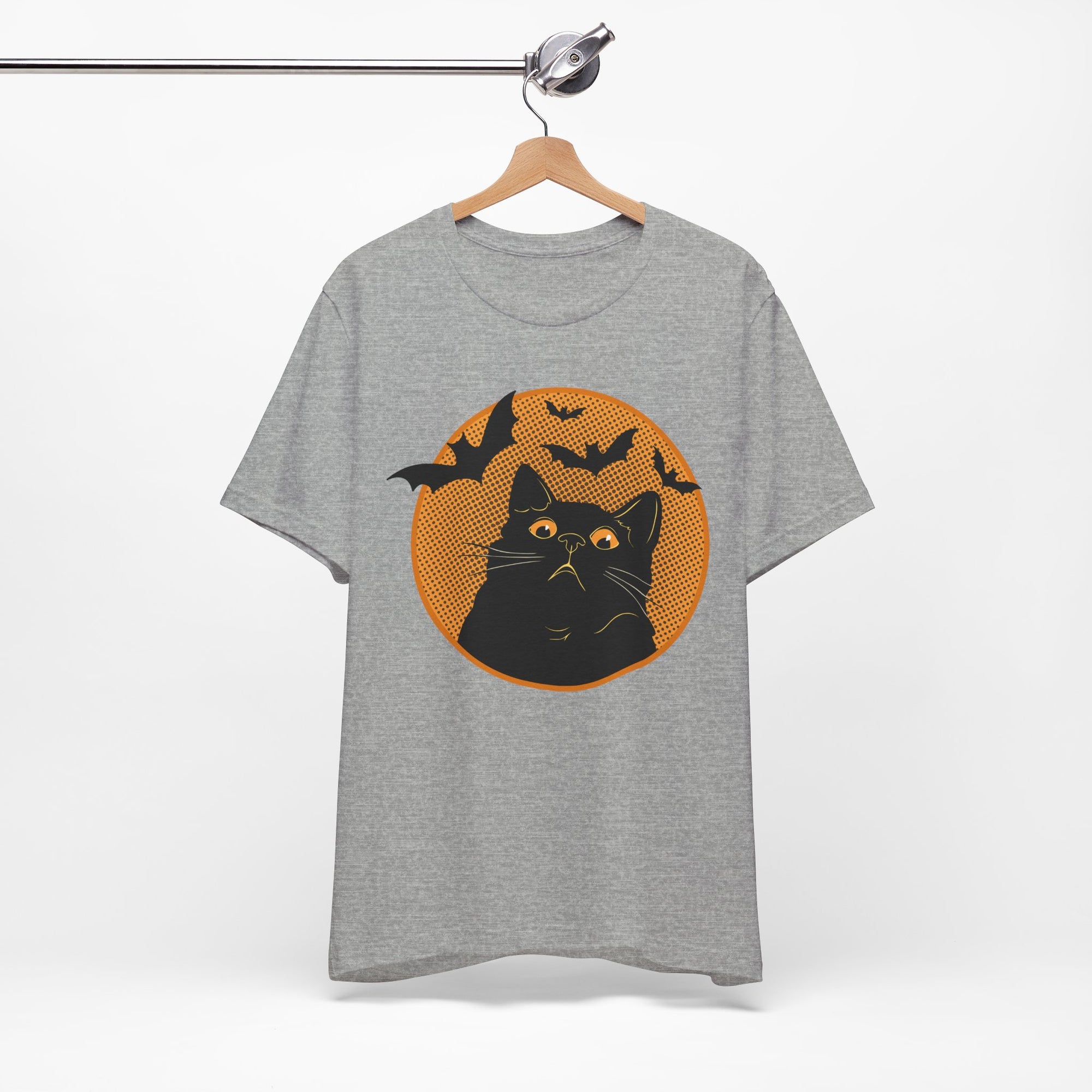 Grey t-shirt featuring a retro-style black cat graphic with orange moon, flying bats, and Halloween-inspired details.