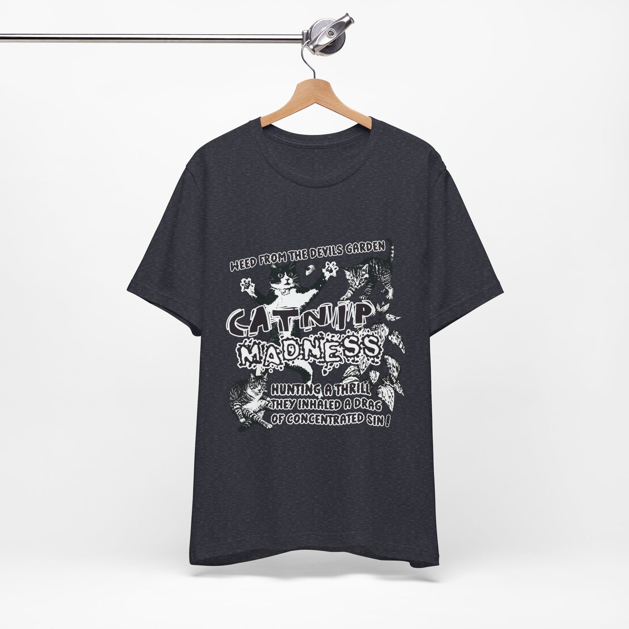 Black t-shirt with white graphic design on a hanger against a white background