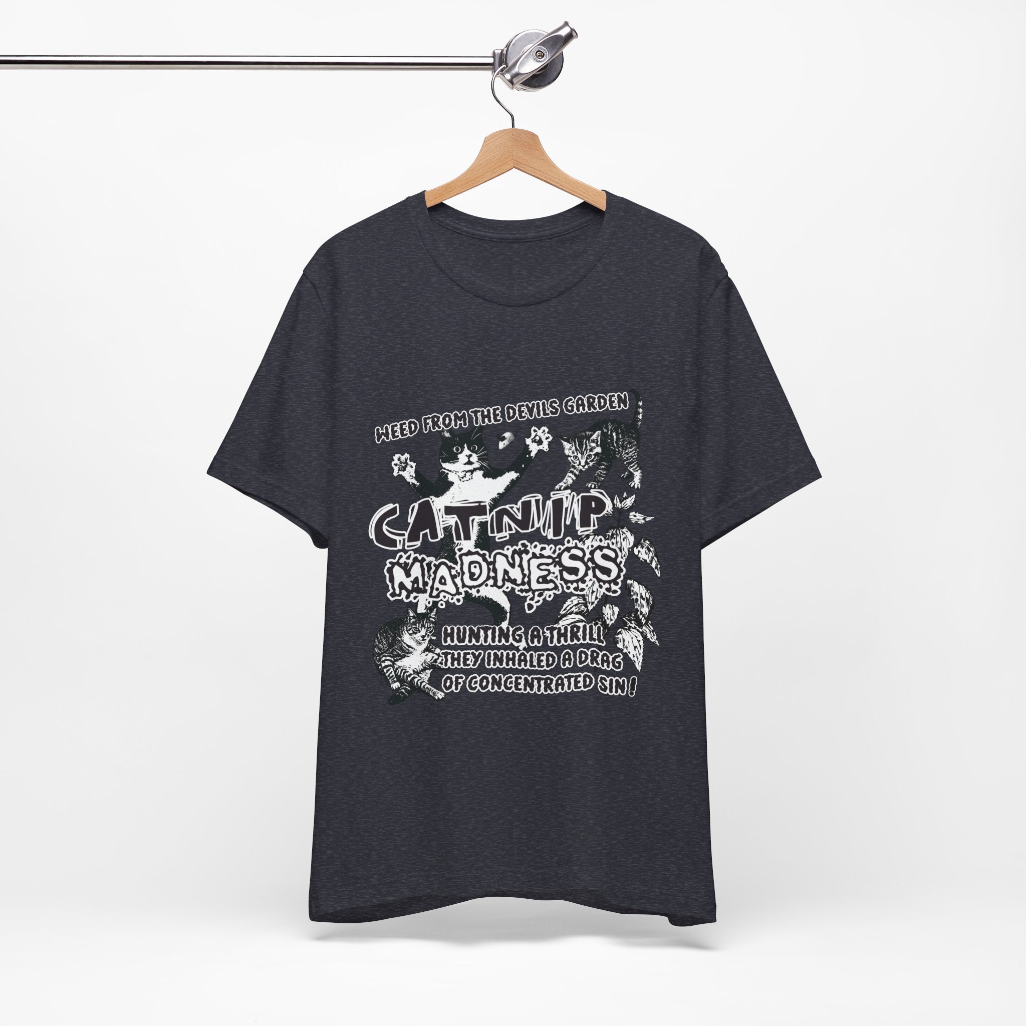 Black t-shirt with white graphic design on a hanger against a white background