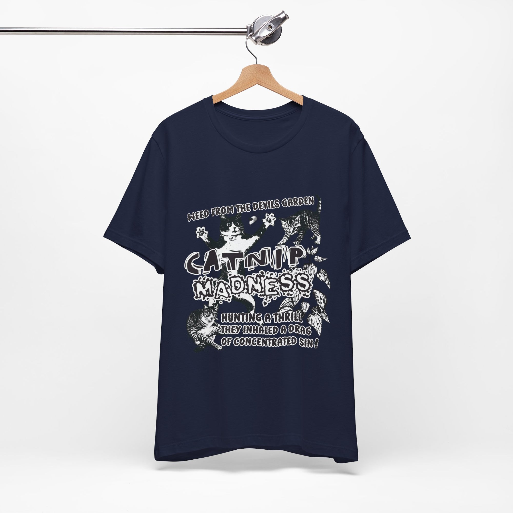 Navy blue t-shirt with white graphic design on a hanger against a white background