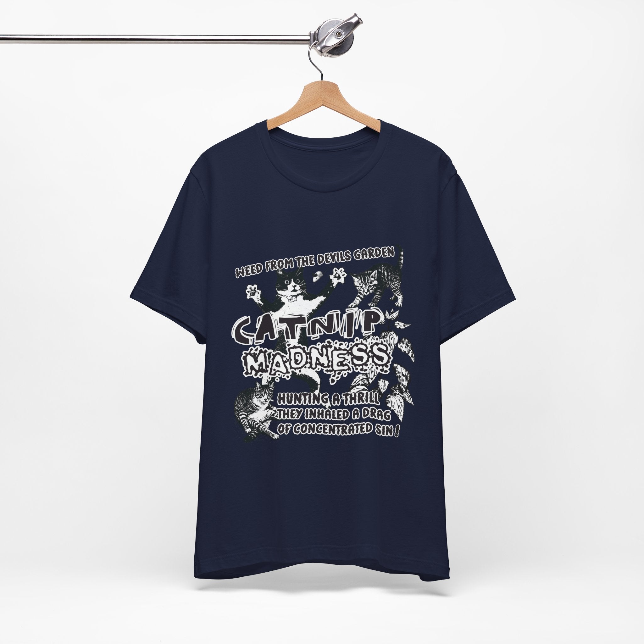 Navy blue t-shirt with white graphic design on a hanger against a white background