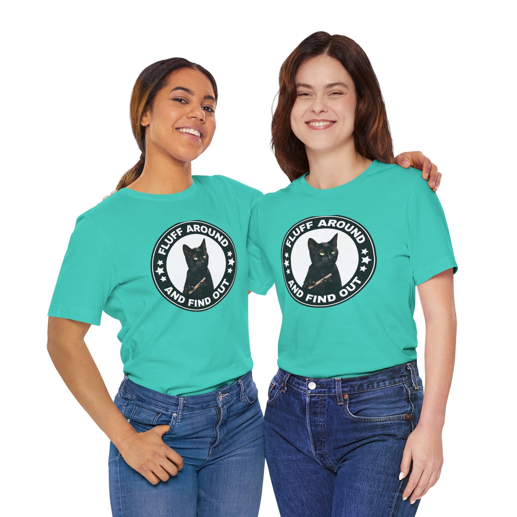 Two people wearing turquoise t-shirt featuring a circular badge design with a black cat and the phrase “Fluff Around and Find Out.”