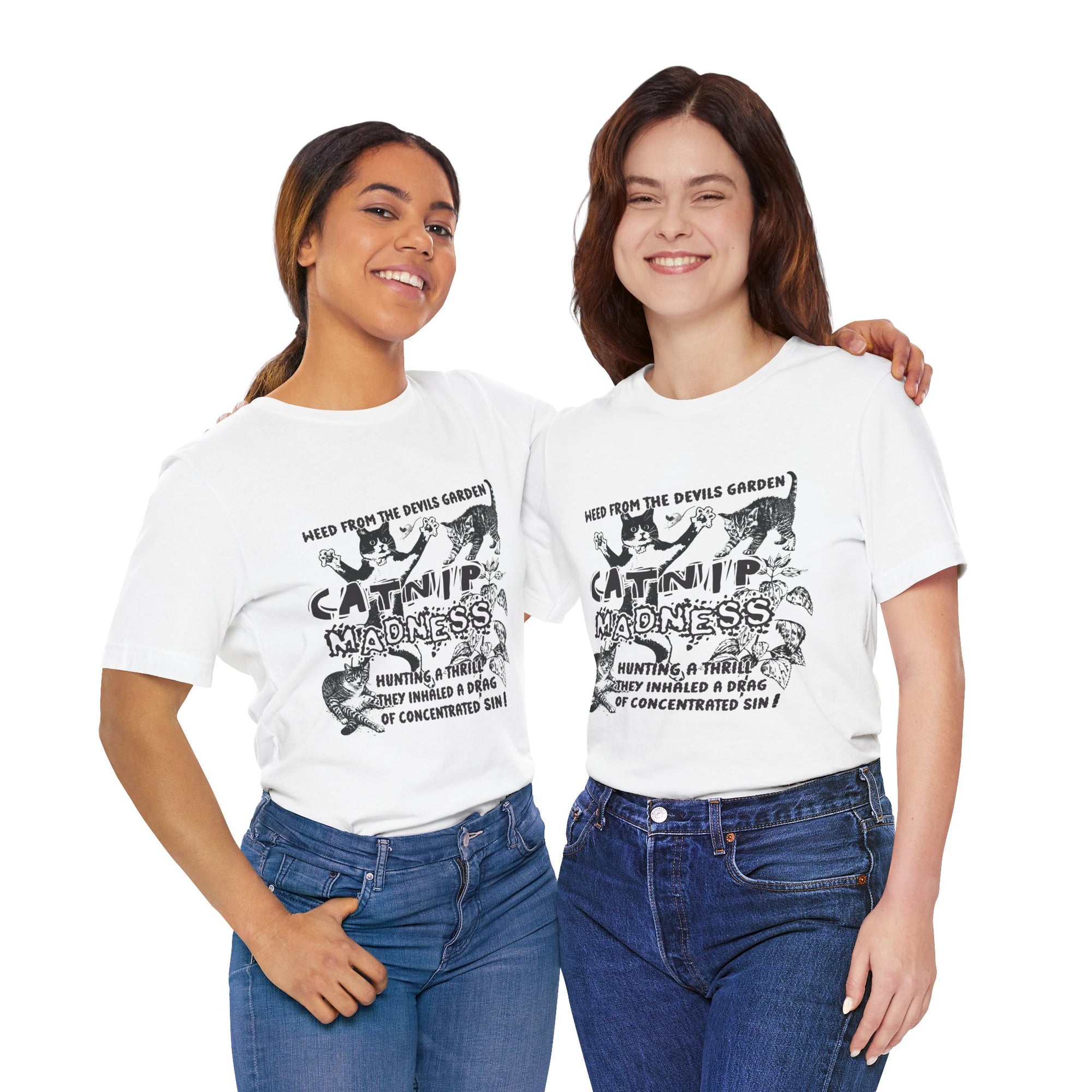 Two women wearing white t-shirts with black graphics and text, standing side by side against a white background.