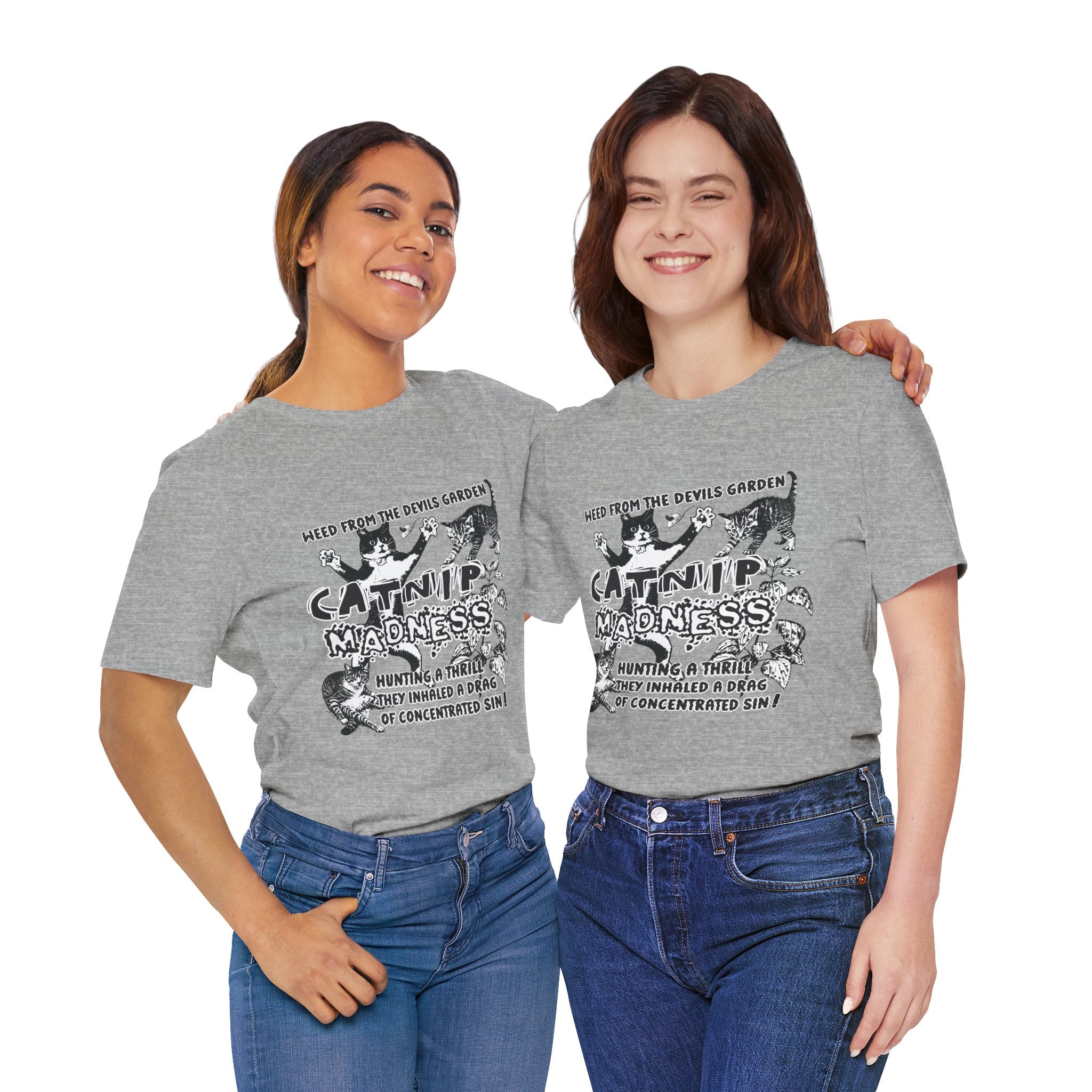 Two women wearing gray t-shirts with a graphic design and text.