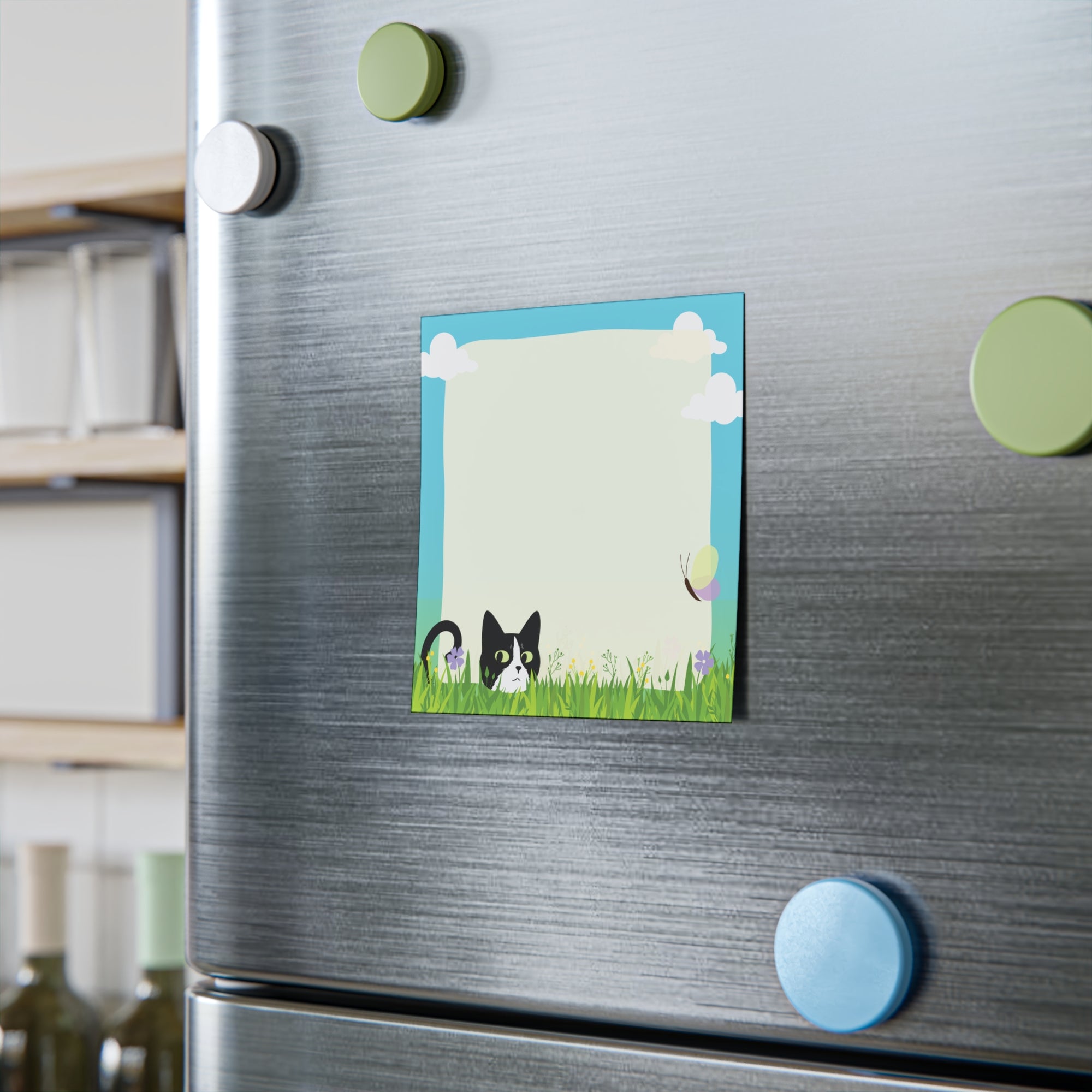 Stack of sticky notes with a black and white cat peeking from tall grass, flowers, clouds, and a light blank writing area in the center.
