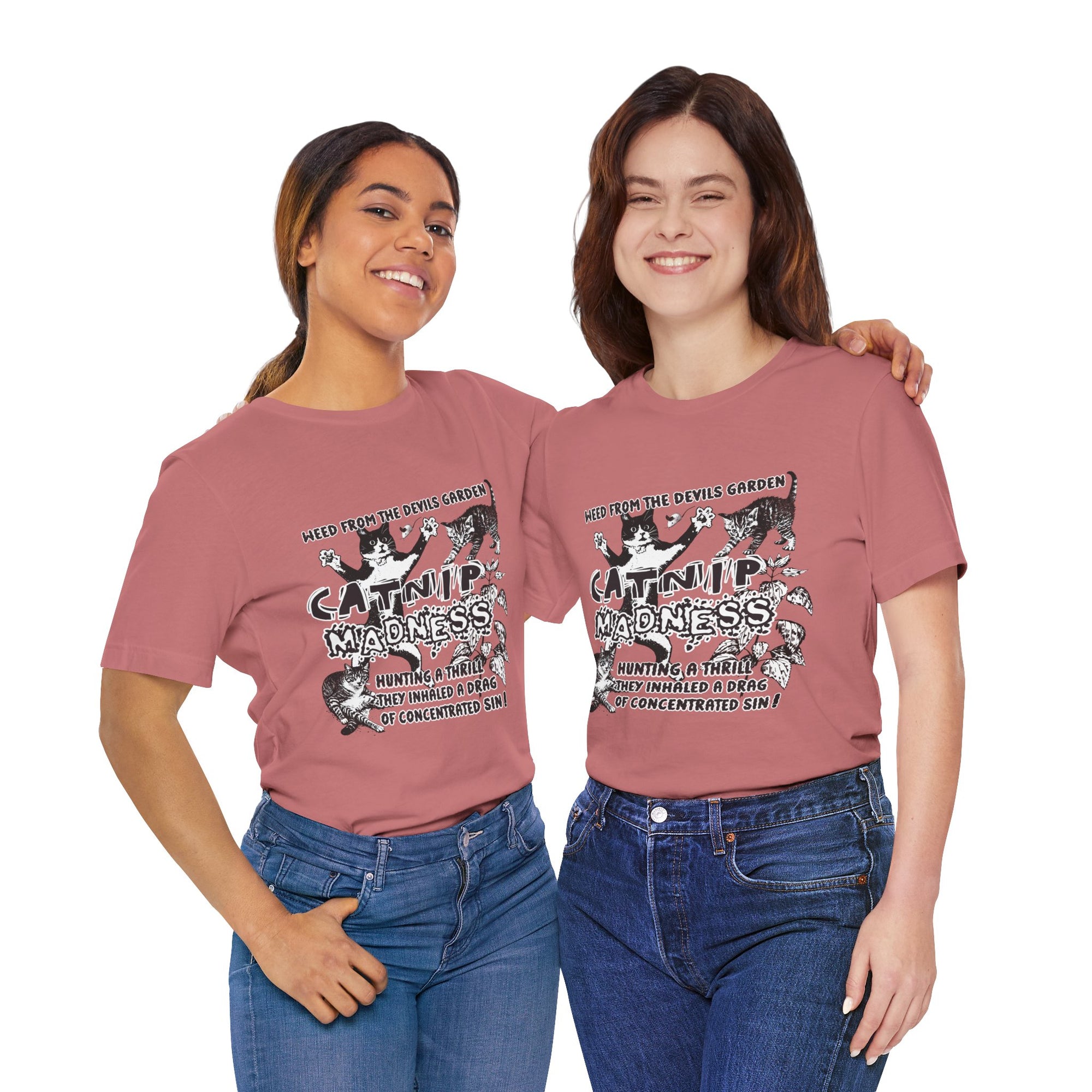 Two people wearing pink t-shirts with a graphic design and text.